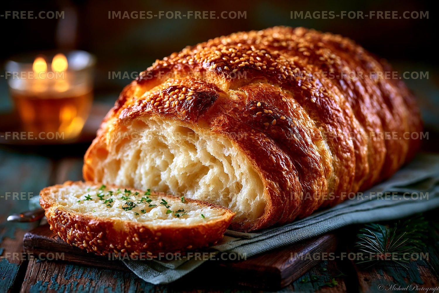 Freshly baked sesame bread on a wooden table with soft lighting