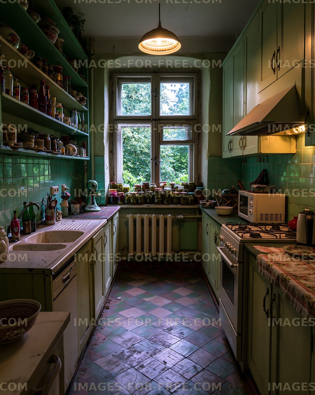 Vintage kitchen with green cabinets and jars on the windowsill