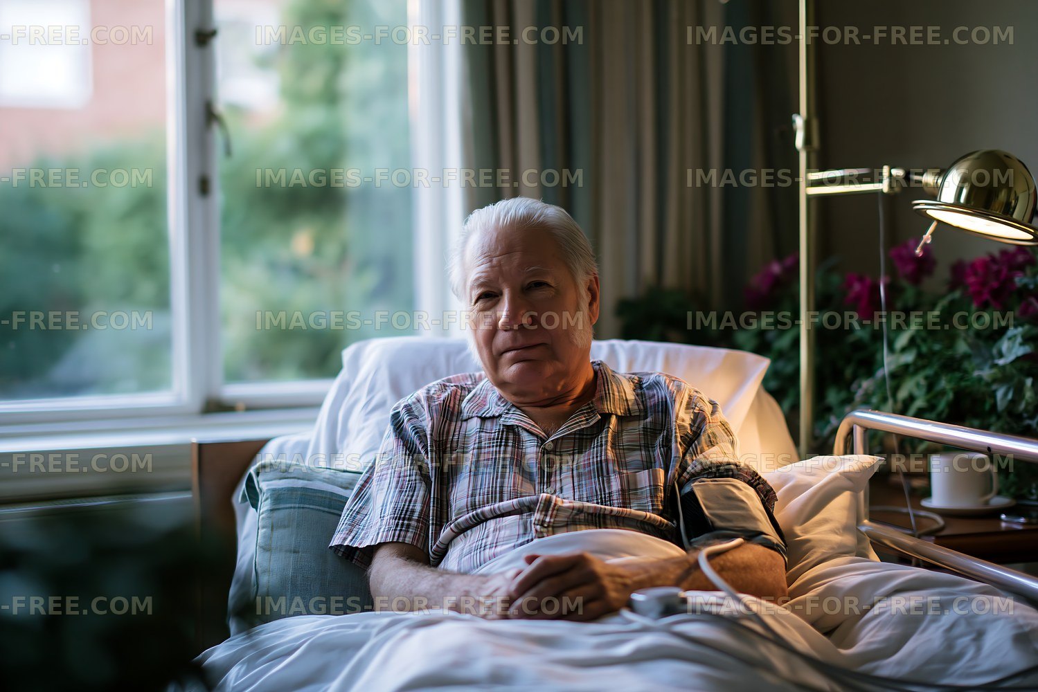 Elderly man resting in bed with medical equipment nearby