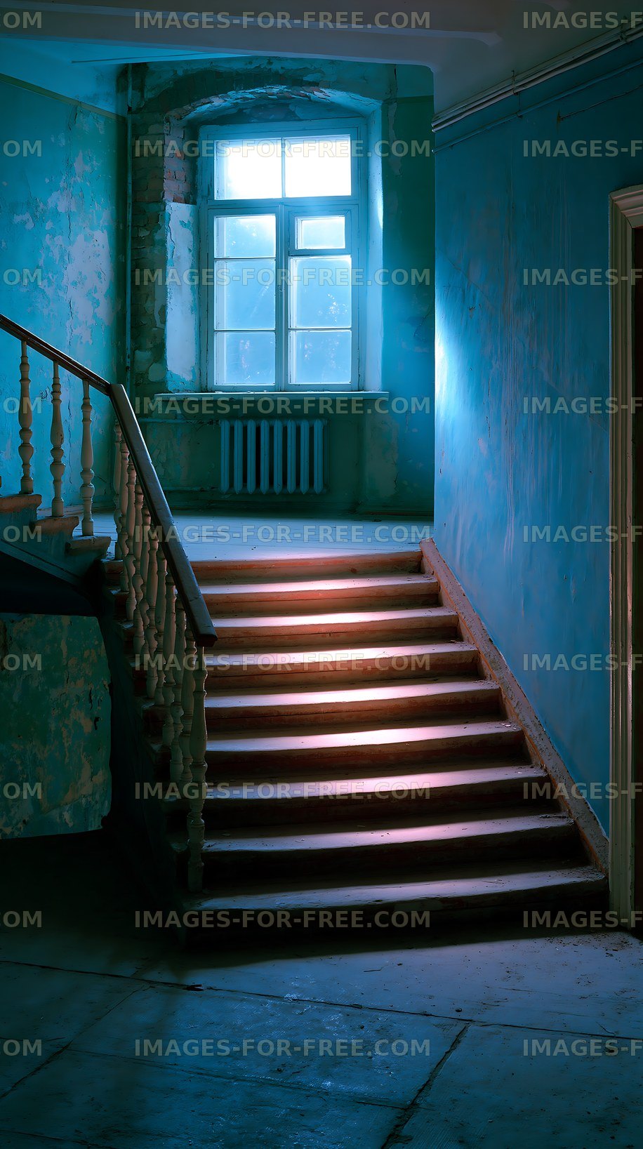 Staircase with blue walls and natural light coming through a window