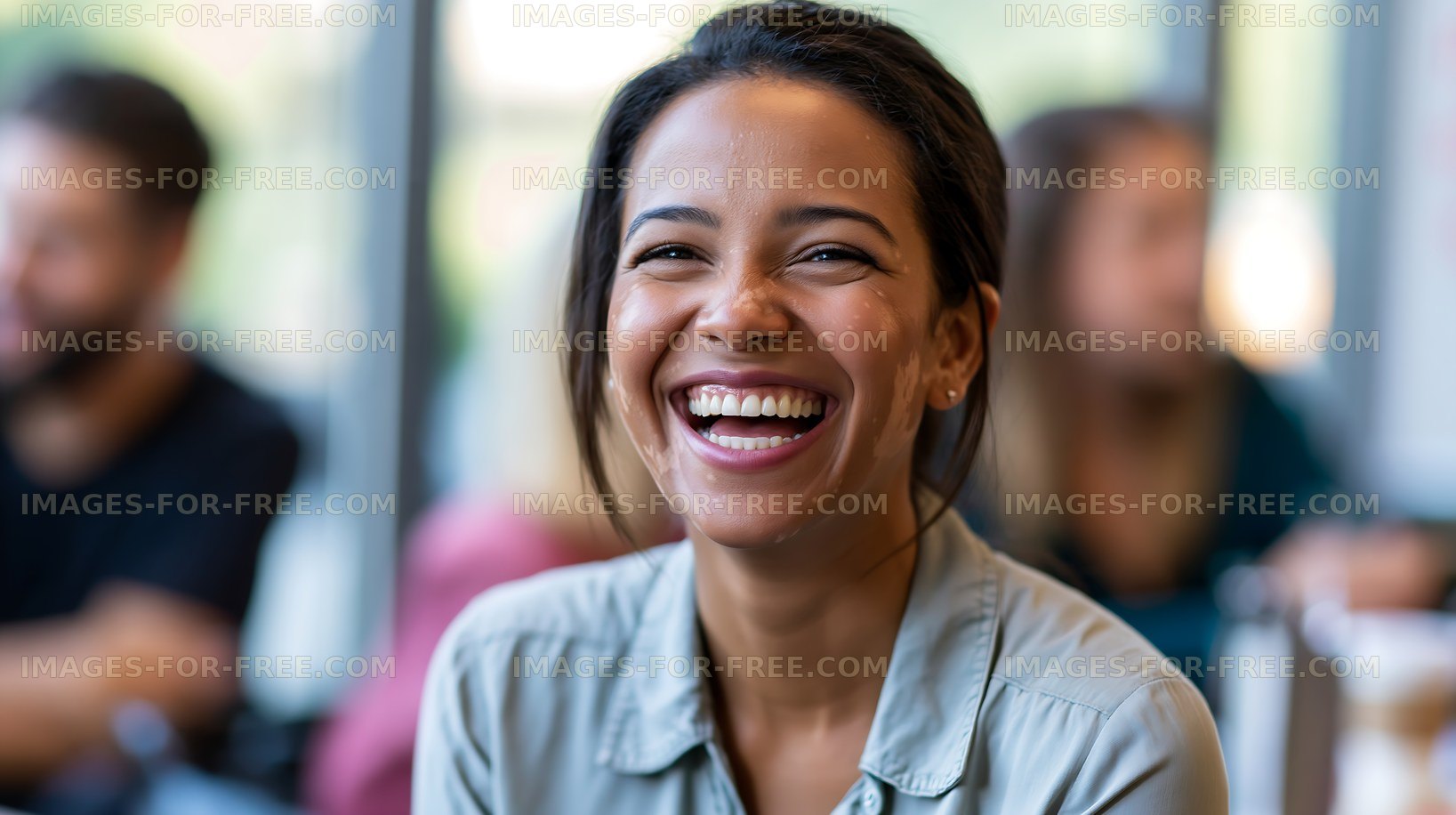 Woman smiling in a cafe with people in the background
