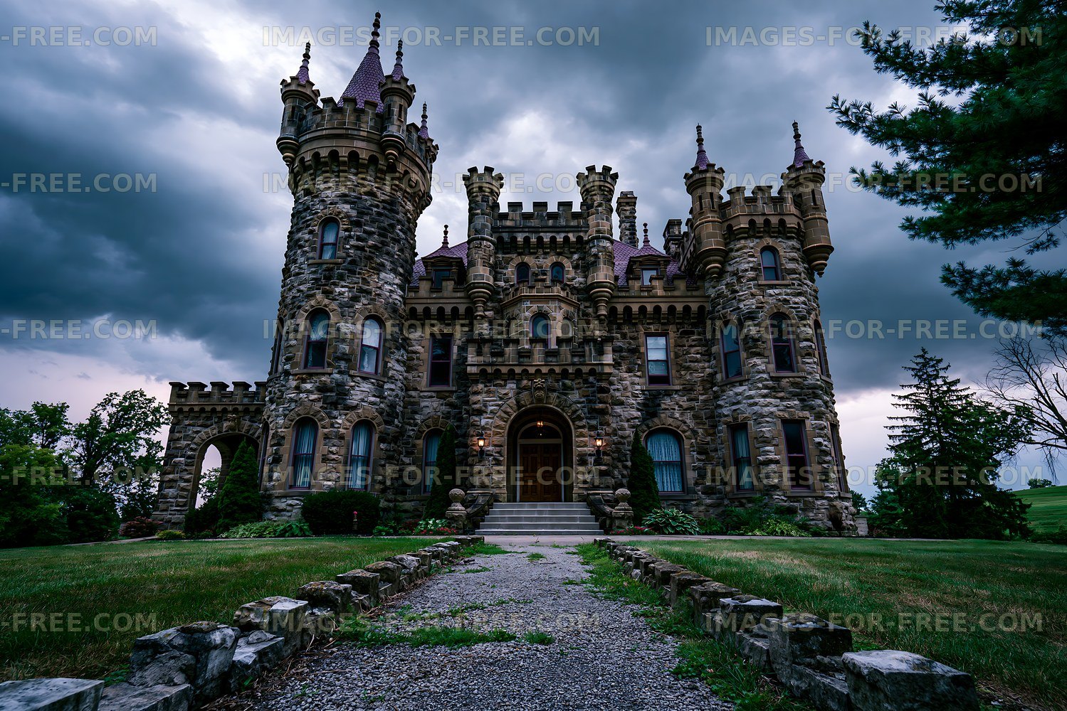 Historic castle with towers under dark cloudy sky