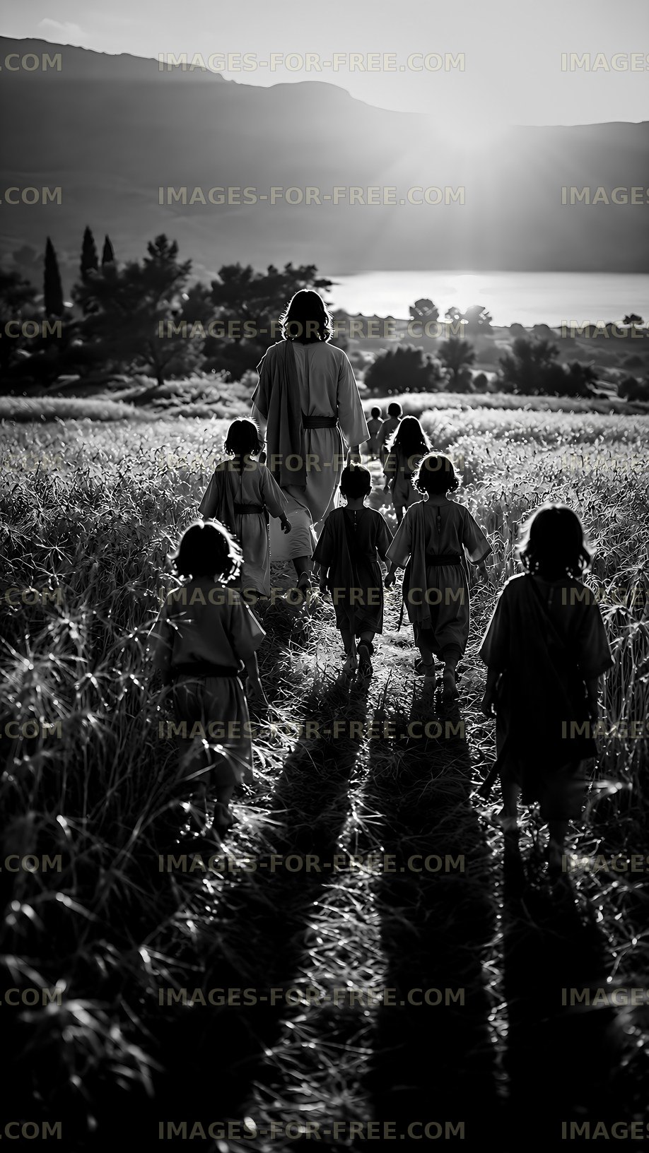 Walking through a field with children at sunset