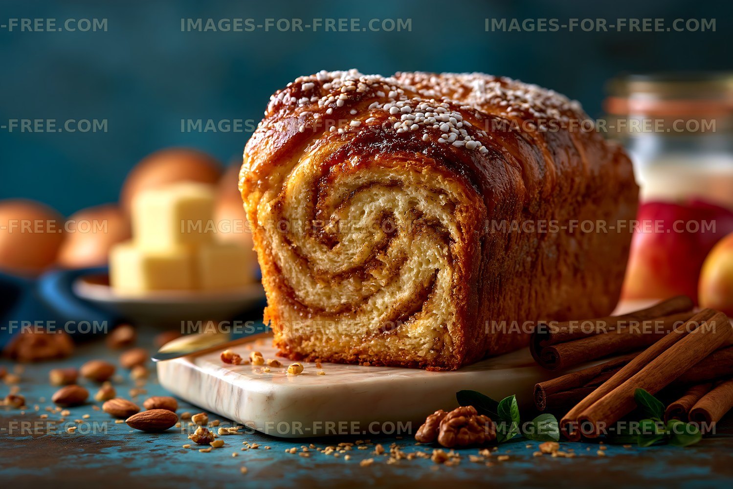 Cinnamon swirl bread with nuts and apples on wooden board