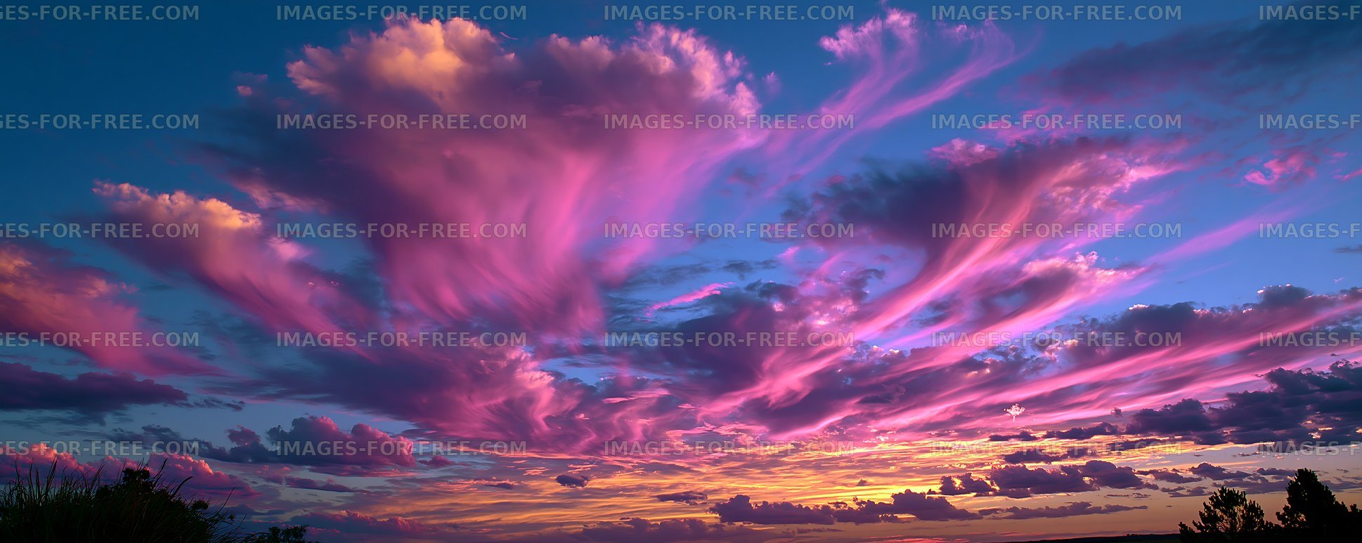 Vibrant clouds at sunset over a rural landscape