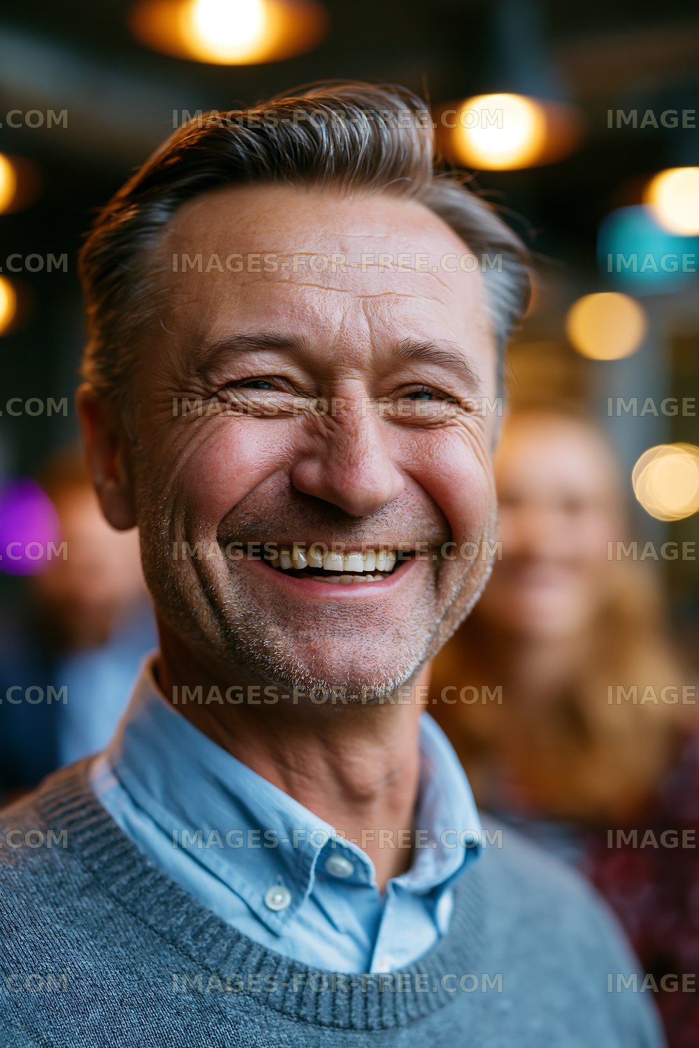Smiling older man at a social gathering