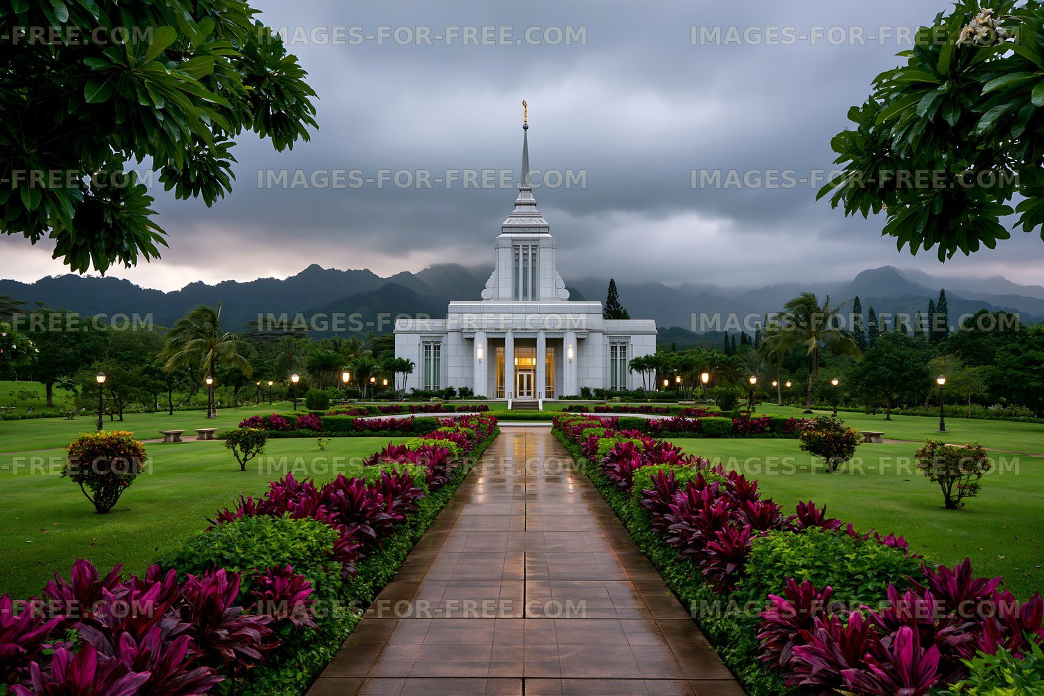 Park pathway leading to temple under cloudy sky
