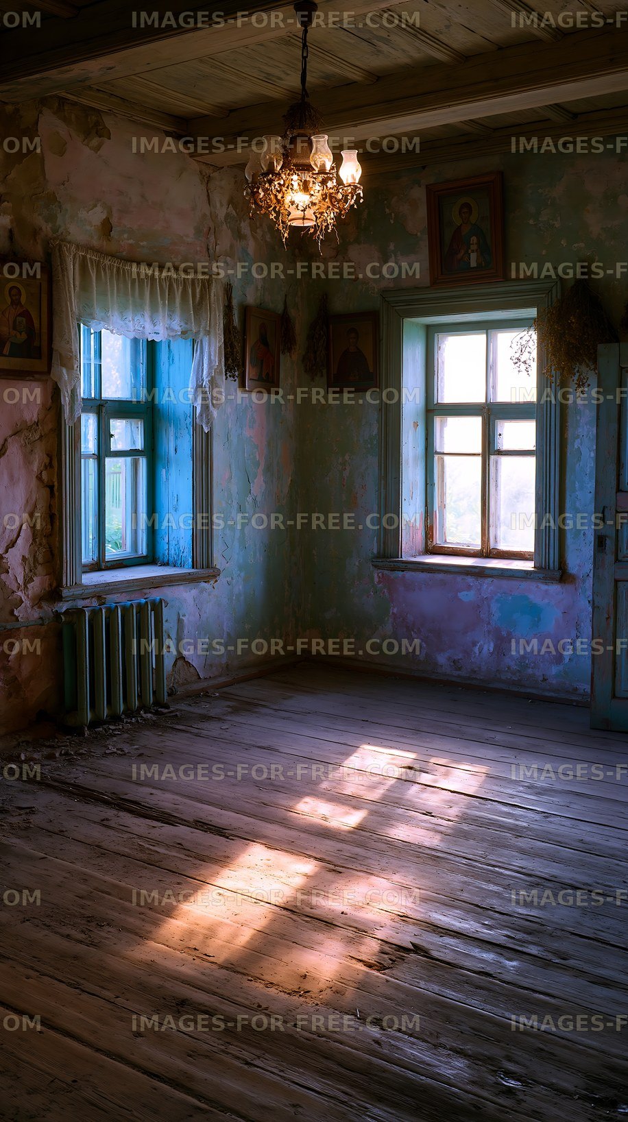 Old room with peeling walls and light streaming through the windows