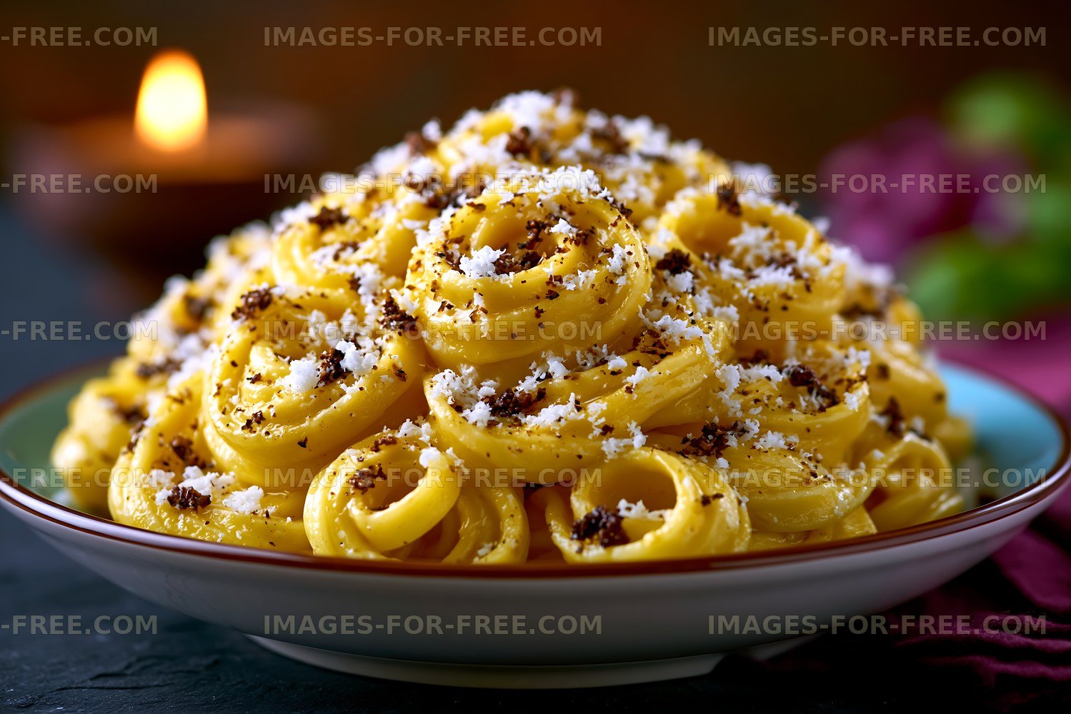 Creamy pasta dish with cheese and black pepper in a bowl