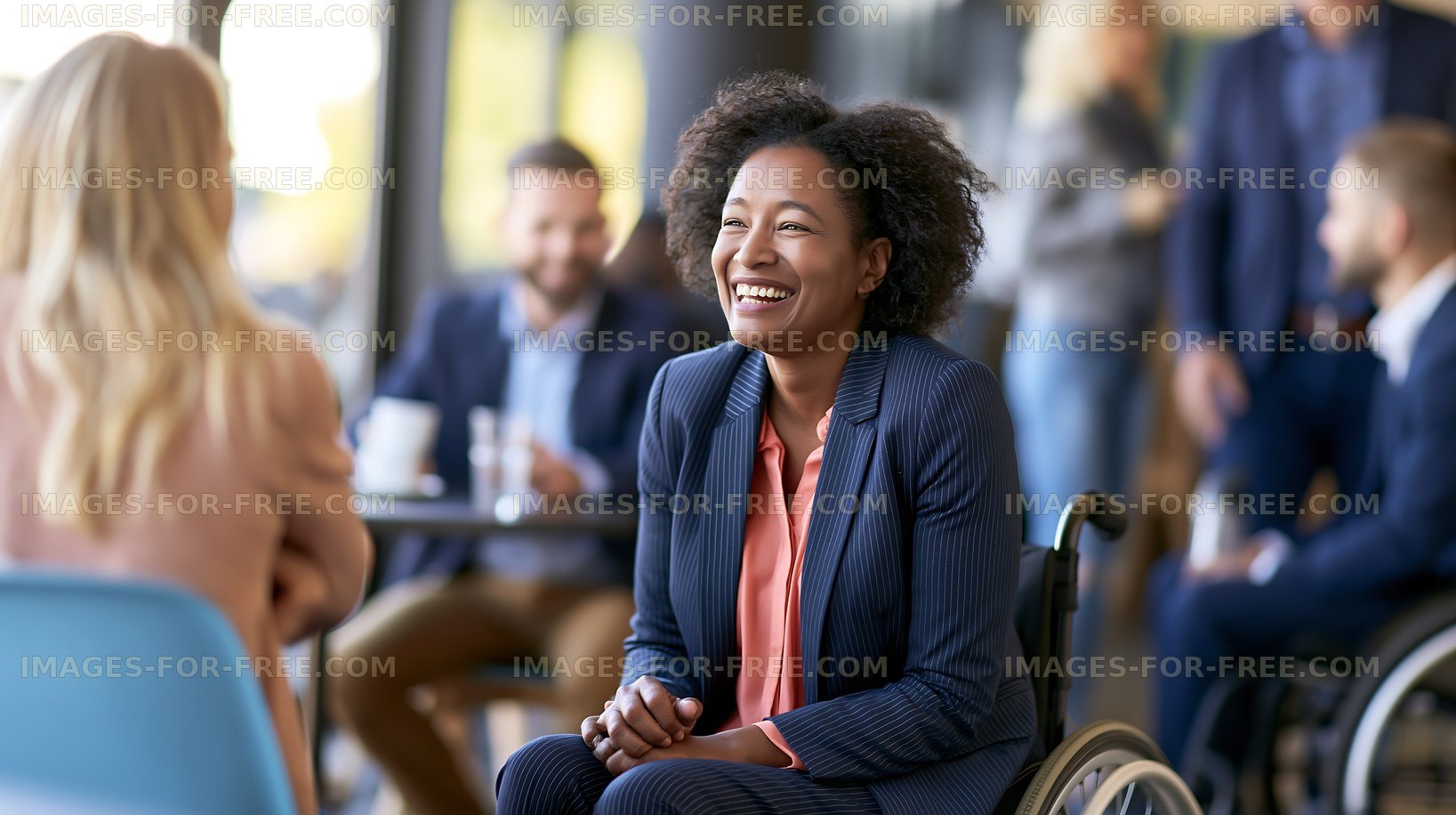 Group of people chatting at a meeting in a modern office space