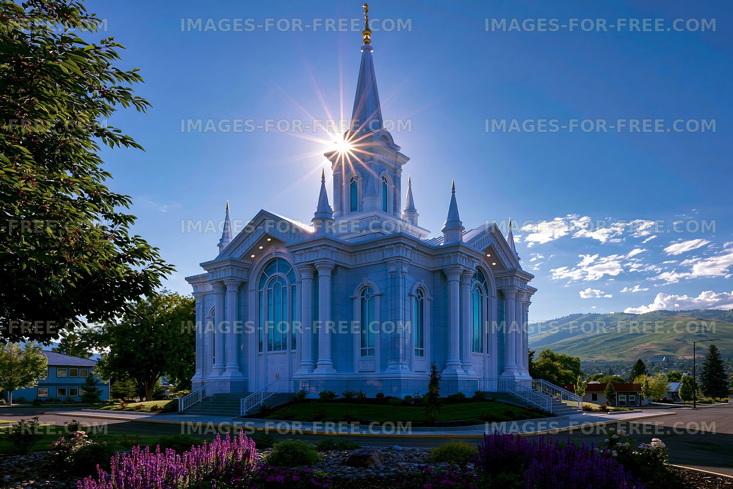 Church building with a tall spire and sunlight shining through