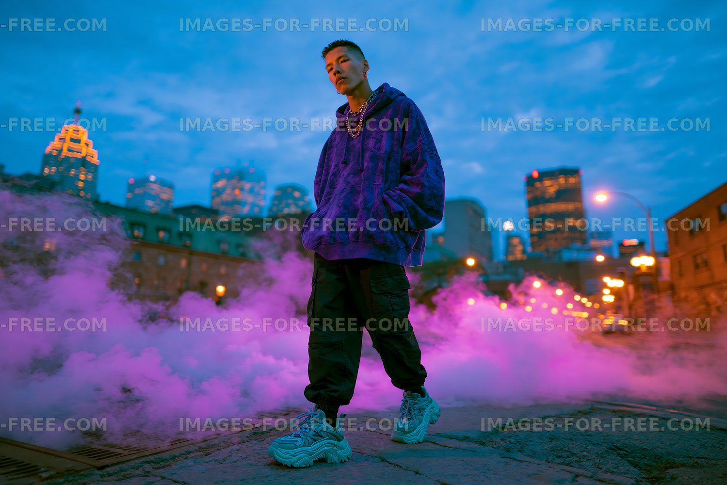 Man stands in city street surrounded by smoke at dusk