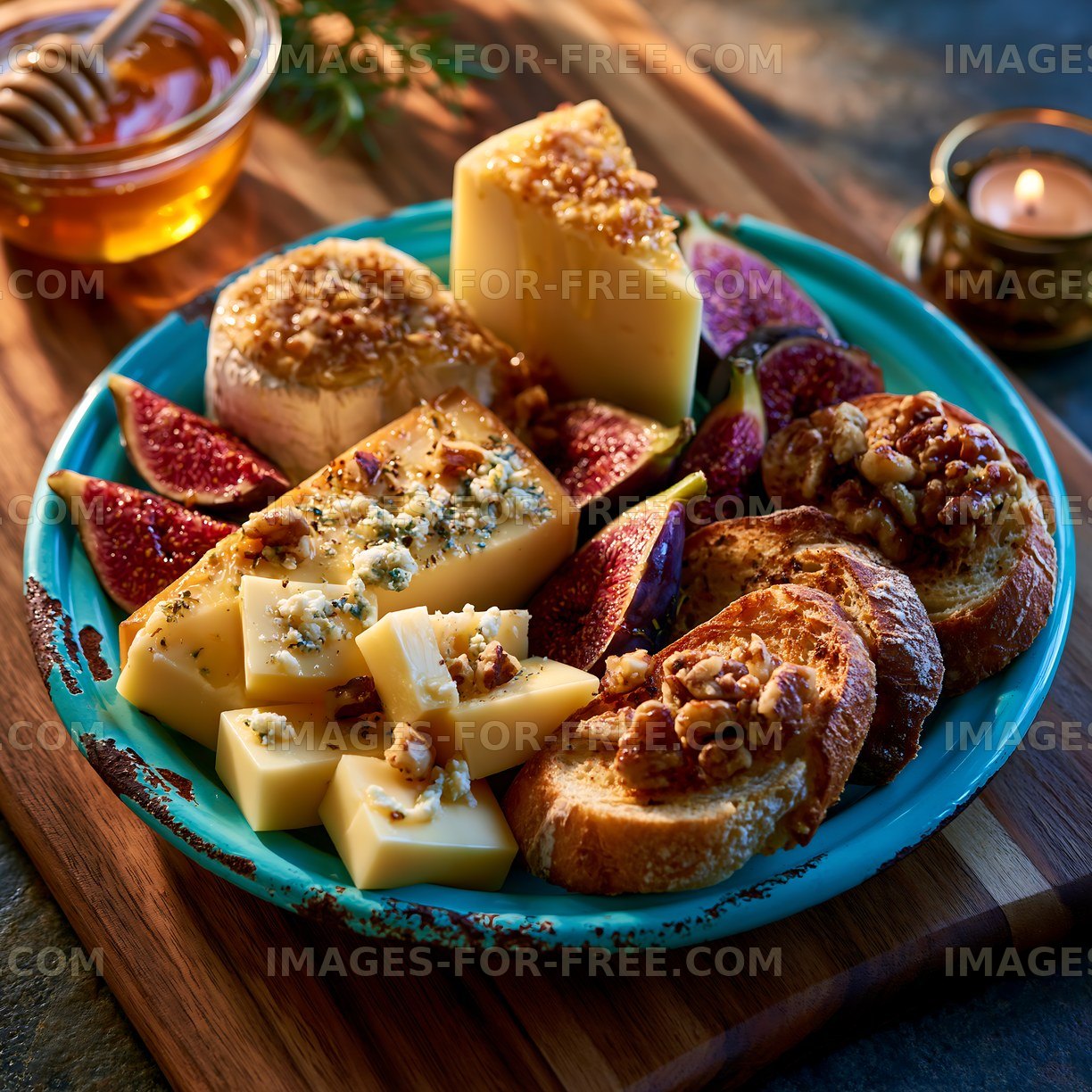 Cheese platter with figs, honey, and snacks on a wooden surface