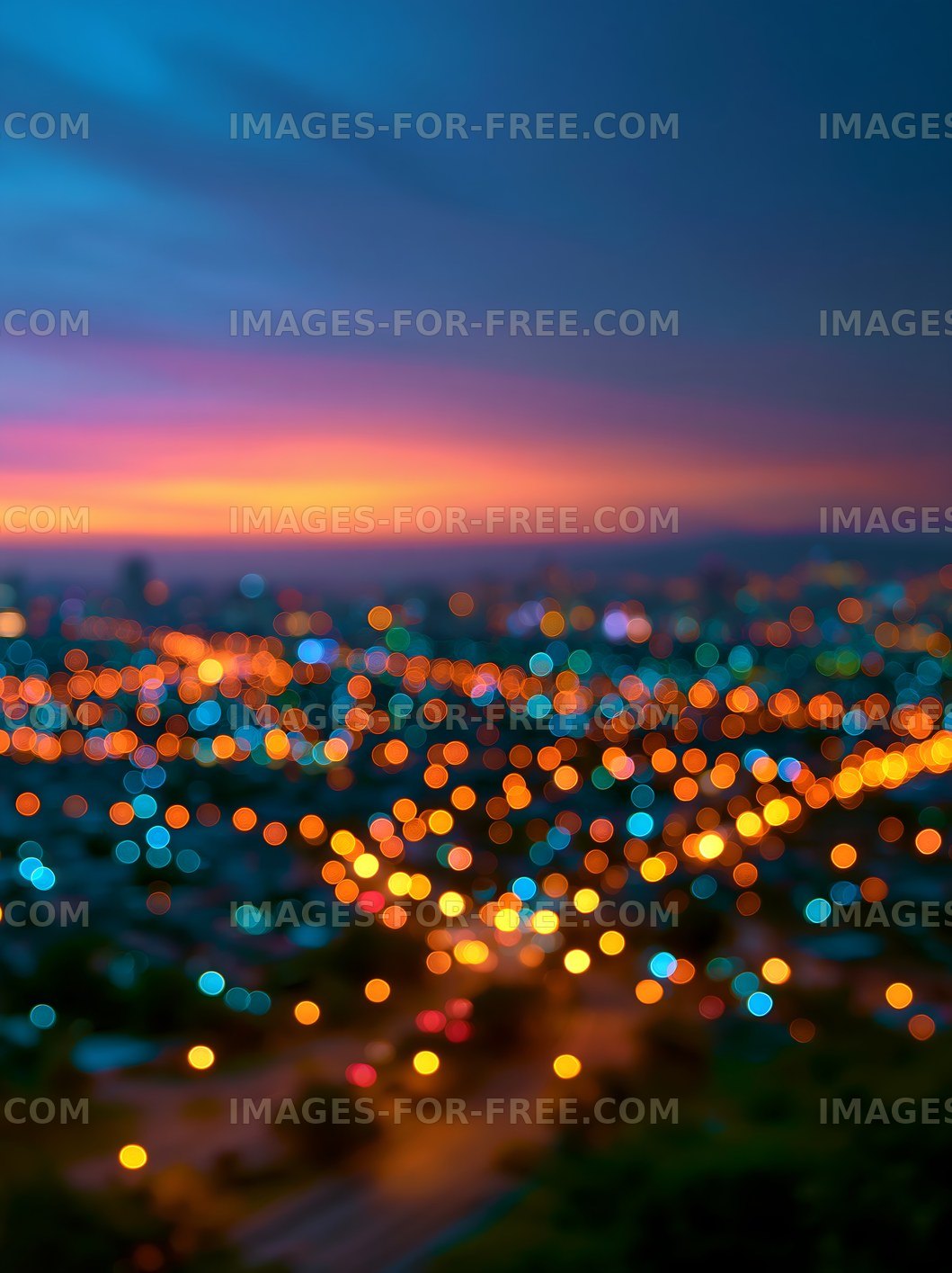 Colorful cityscape at dusk with blurred lights and sunset hues