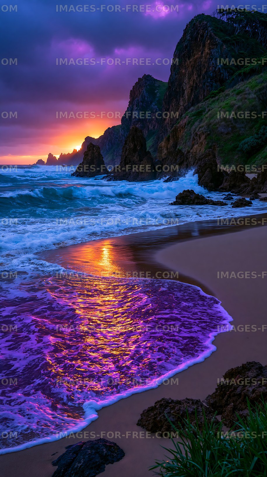 Sunset over rocky beach with waves and purple reflections