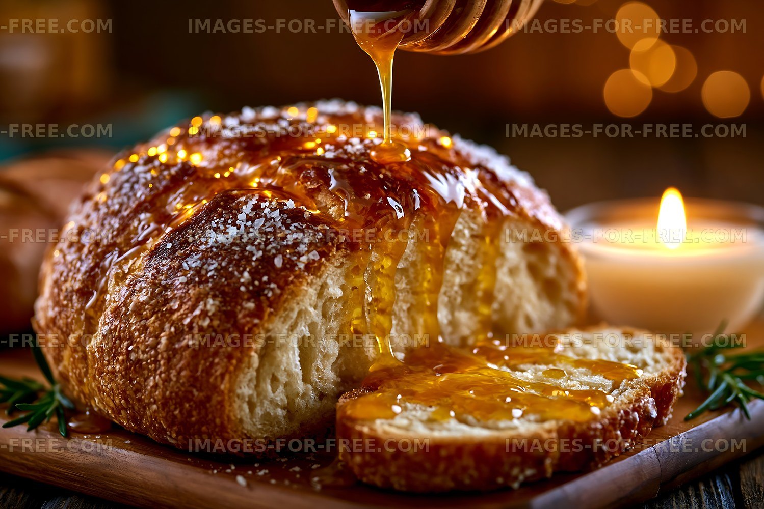 Freshly baked bread with honey drizzling on top and candlelight