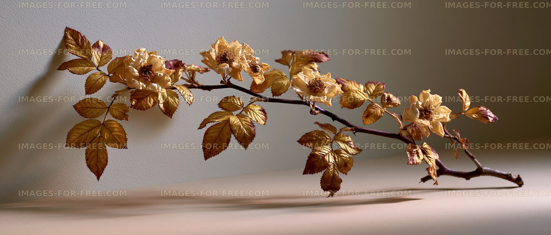Golden branch with flowers and leaves on a simple background
