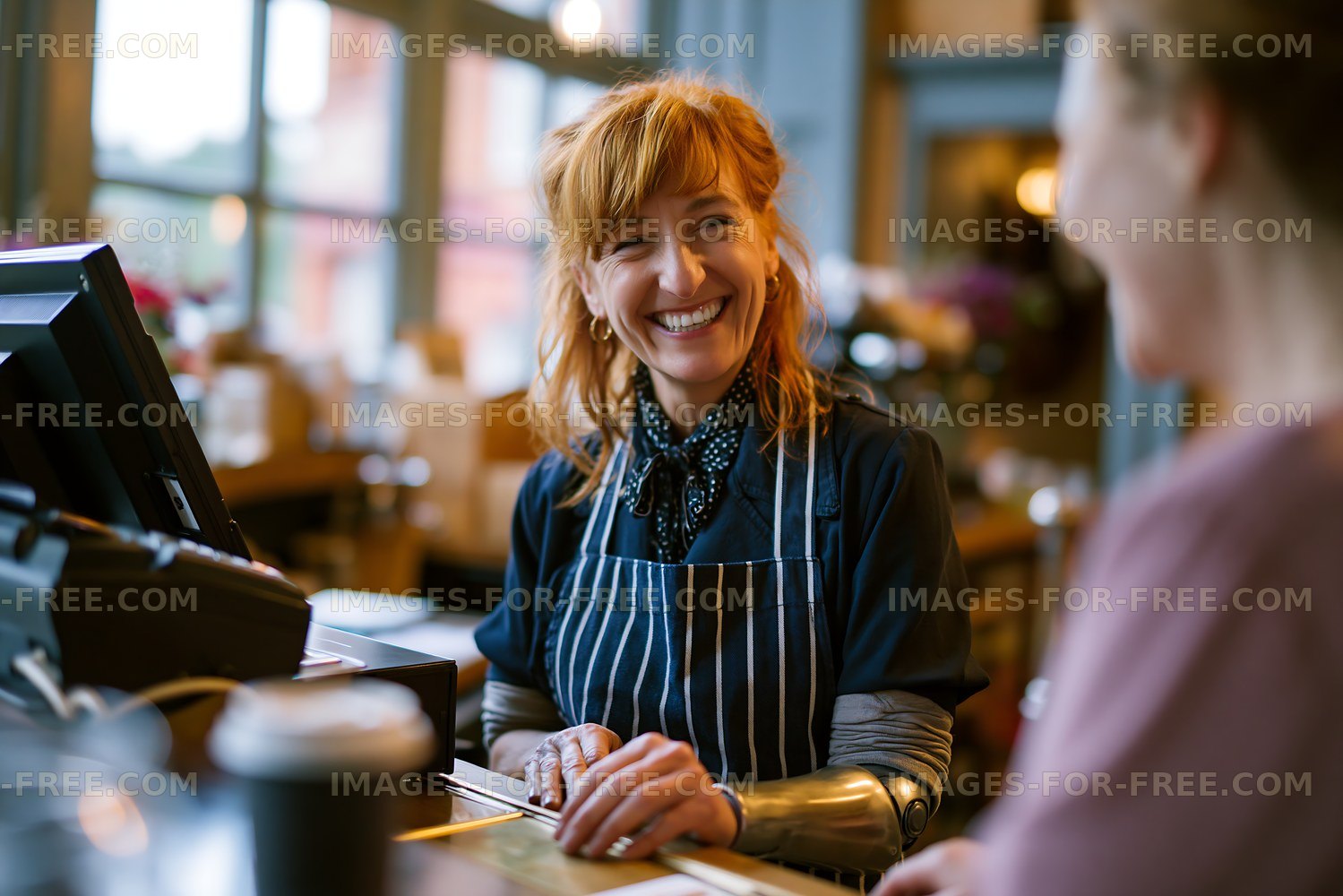 Barista serving coffee in a busy cafe