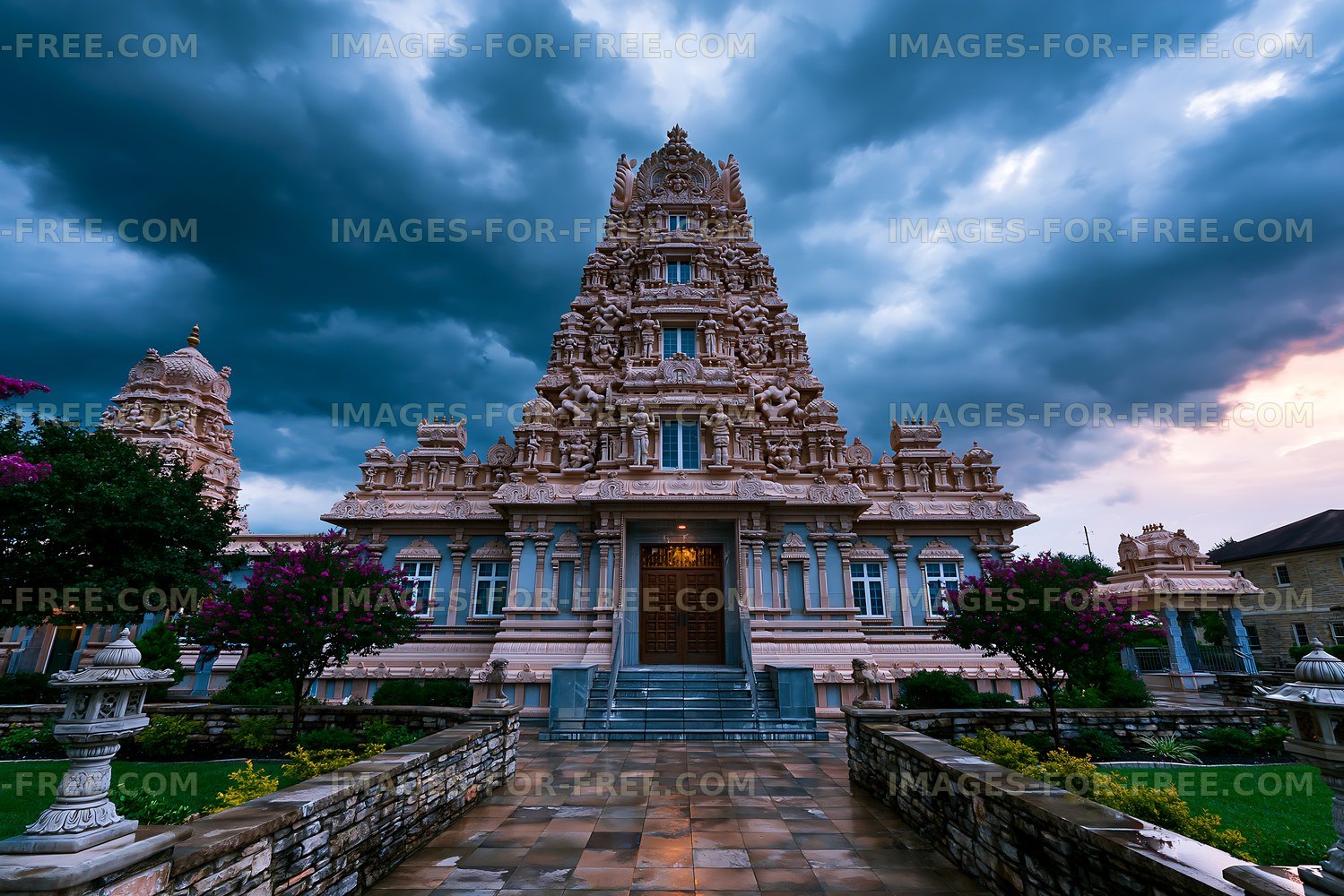 Hindu temple structure under a cloudy sky at dusk