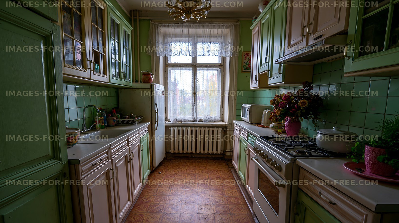 Modern kitchen with green cabinets and natural light