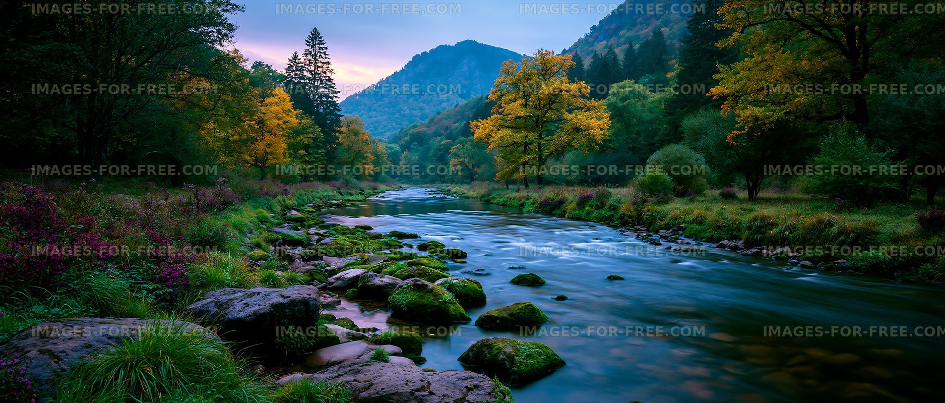 Serene river flows through forest with mountains in the background