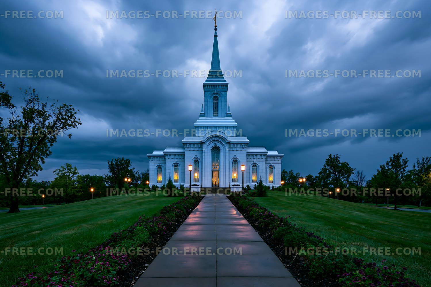 Stormy sky over a white church illuminated at dusk
