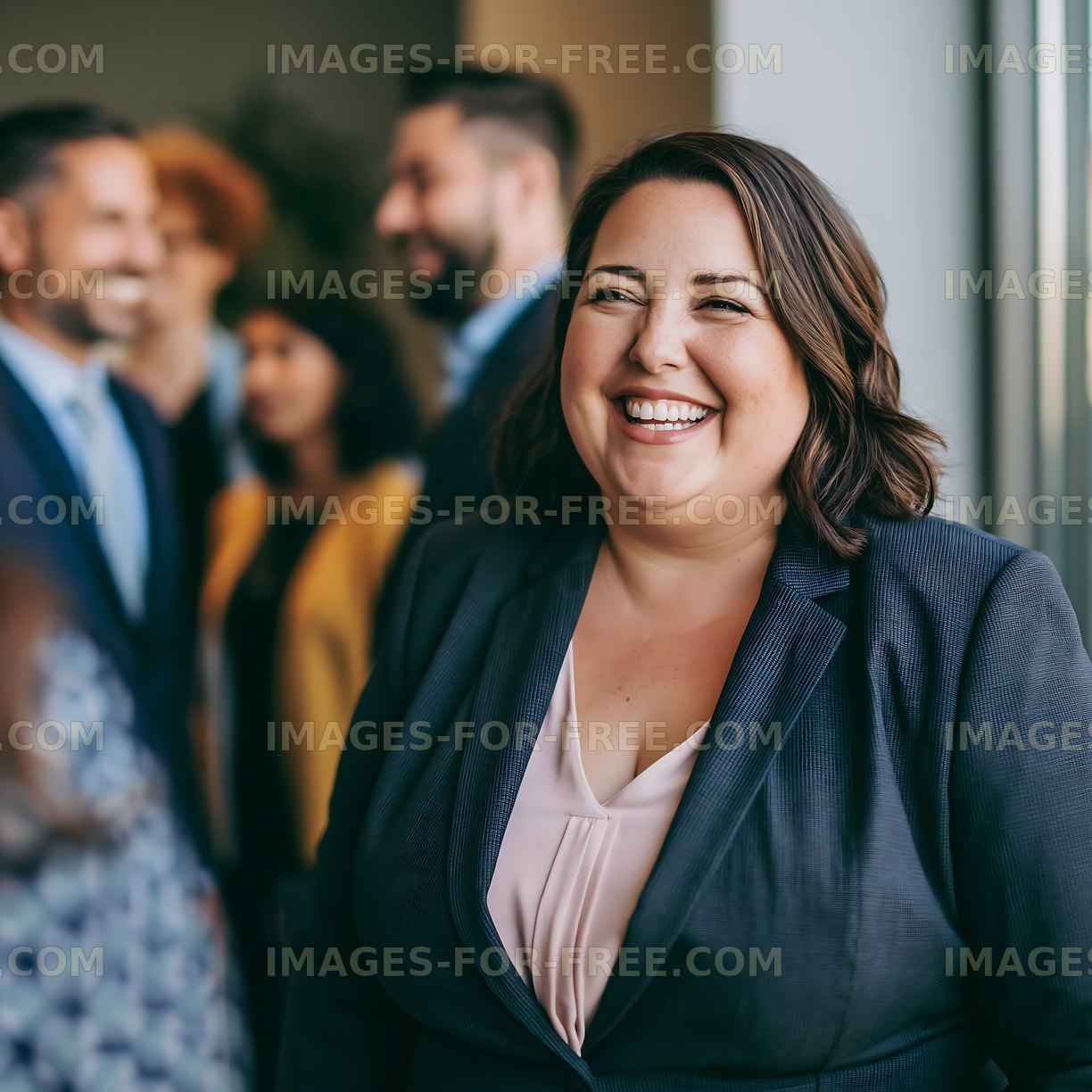 Group of professionals at an office gathering with a smiling woman