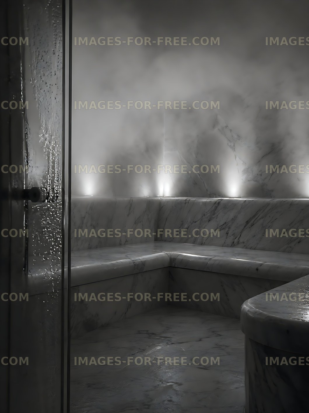 Steam fills a marble steam room with soft lighting