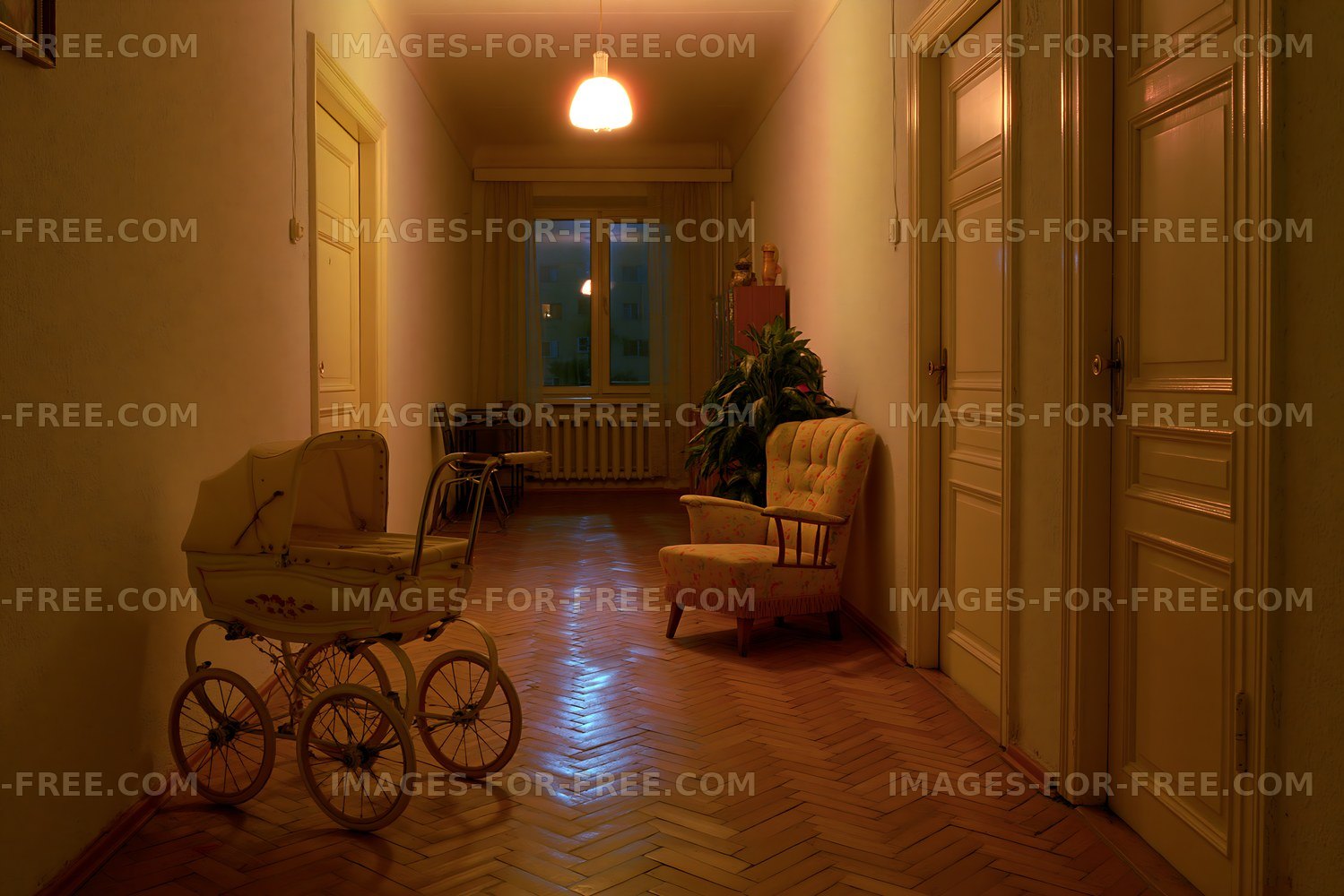 Hallway with vintage pram and chair in softly lit interior space