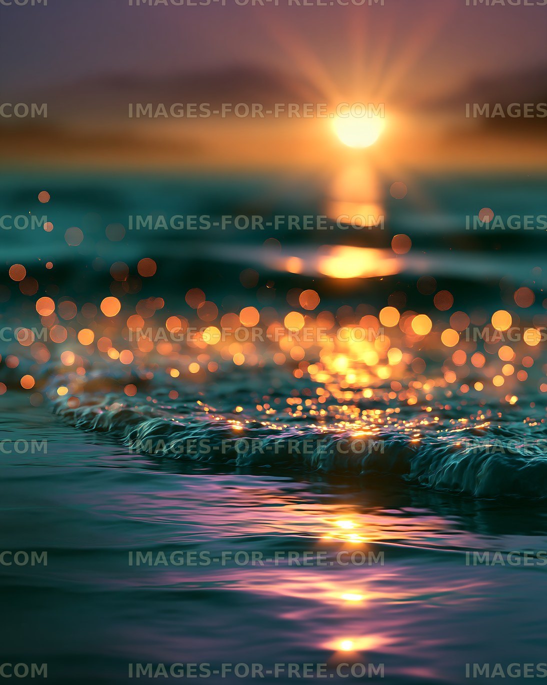 Waves at sunset with sparkling reflections in the water
