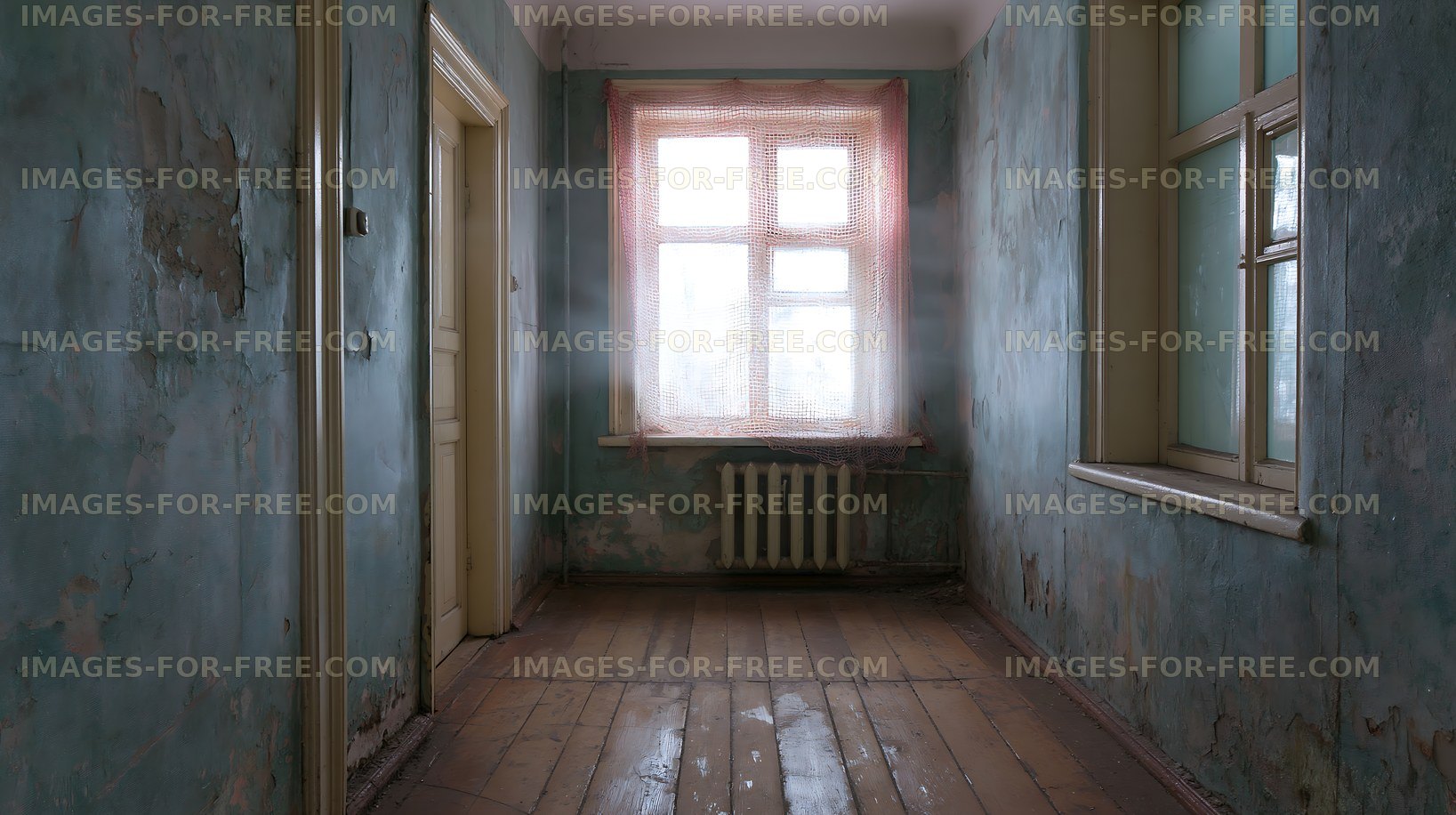 Empty room with faded walls and a window overlooking a cloudy day