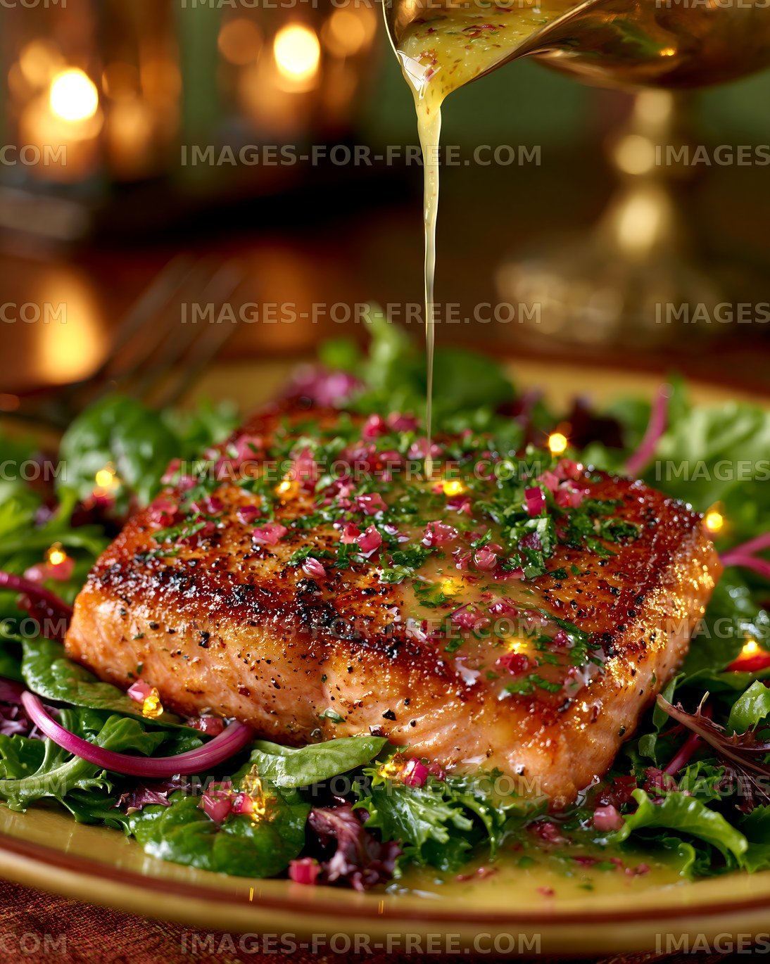 Grilled salmon on a bed of greens with dressing drizzle