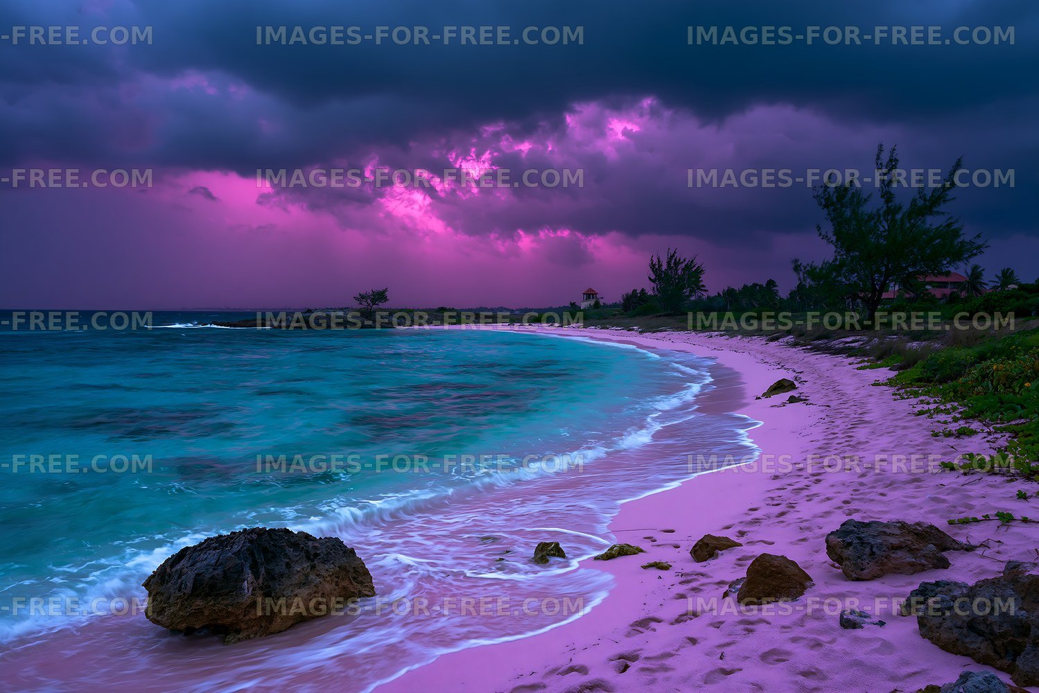 Pink sandy beach with waves and stormy sky at sunset