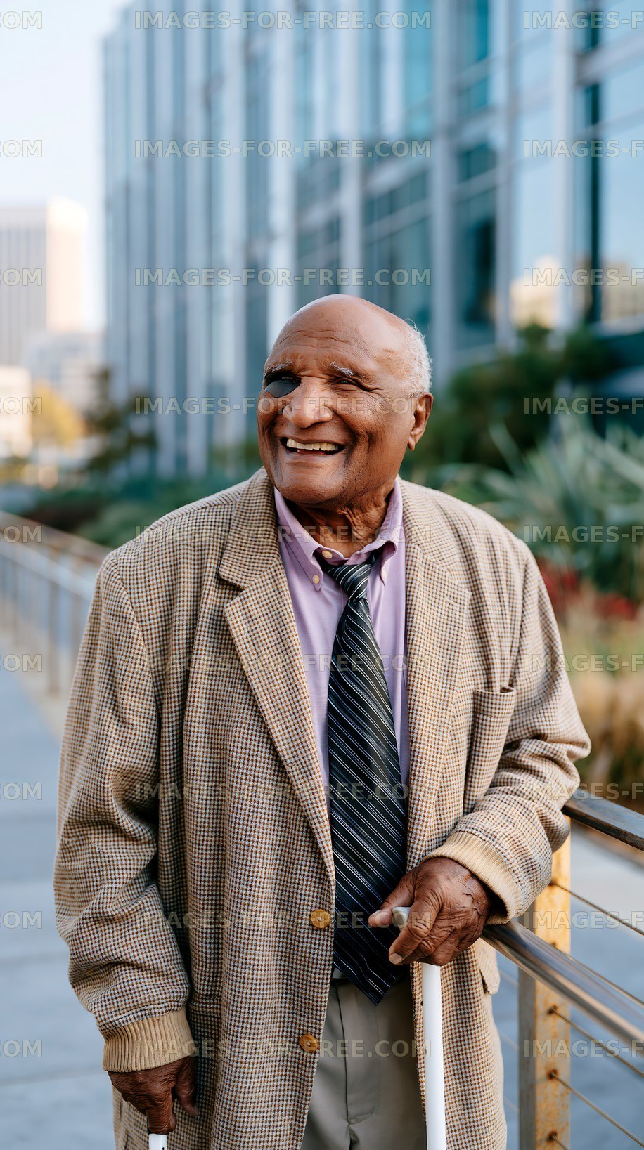 Smiling elderly man standing outdoors in urban environment