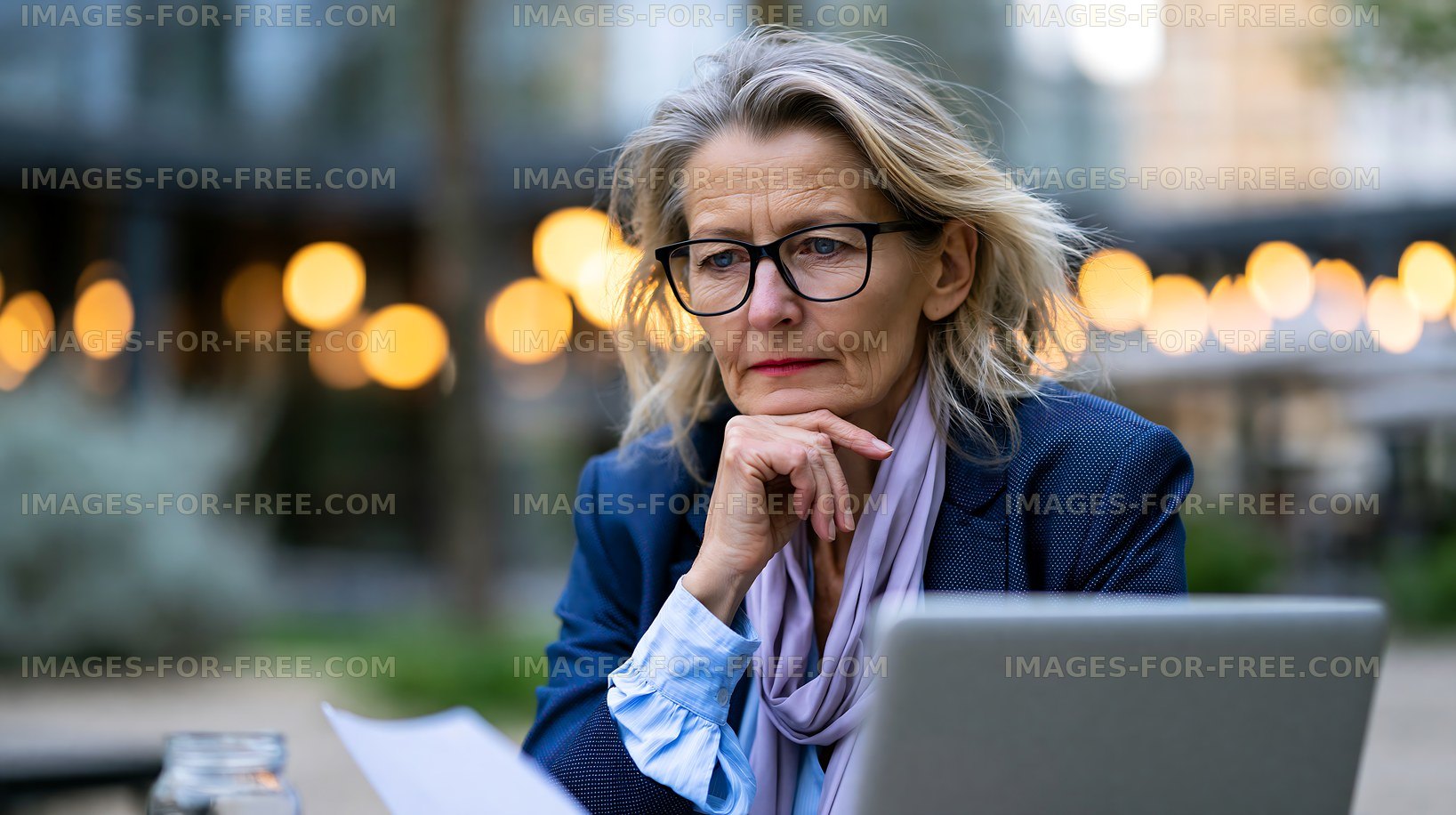 Businesswoman working on a project at an outdoor cafe