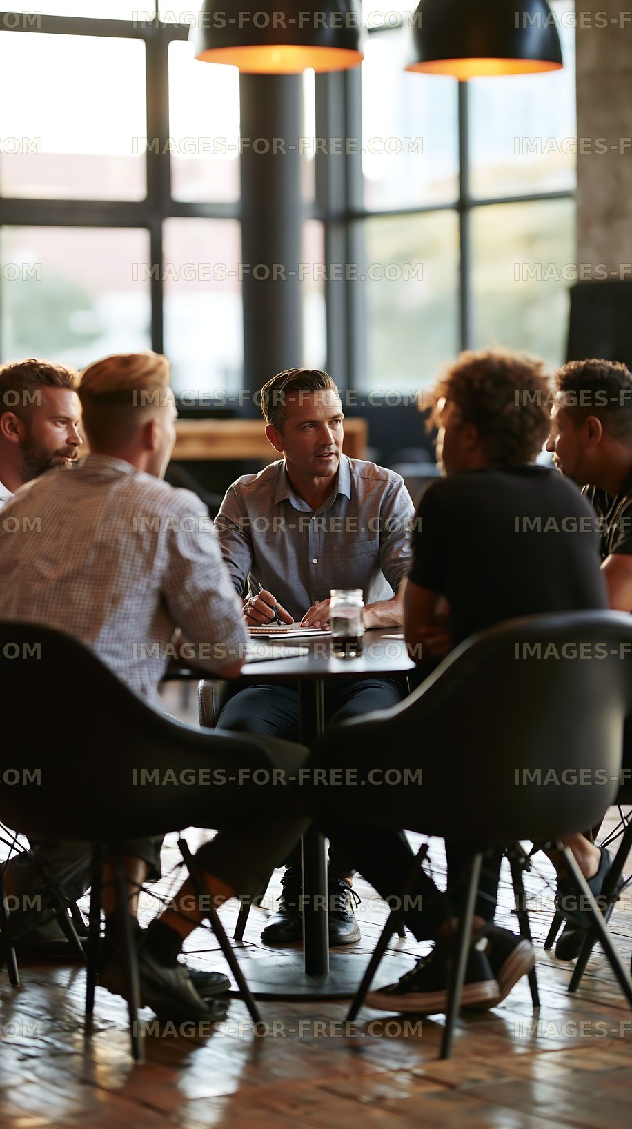 Group discussion at a modern café with focused individuals