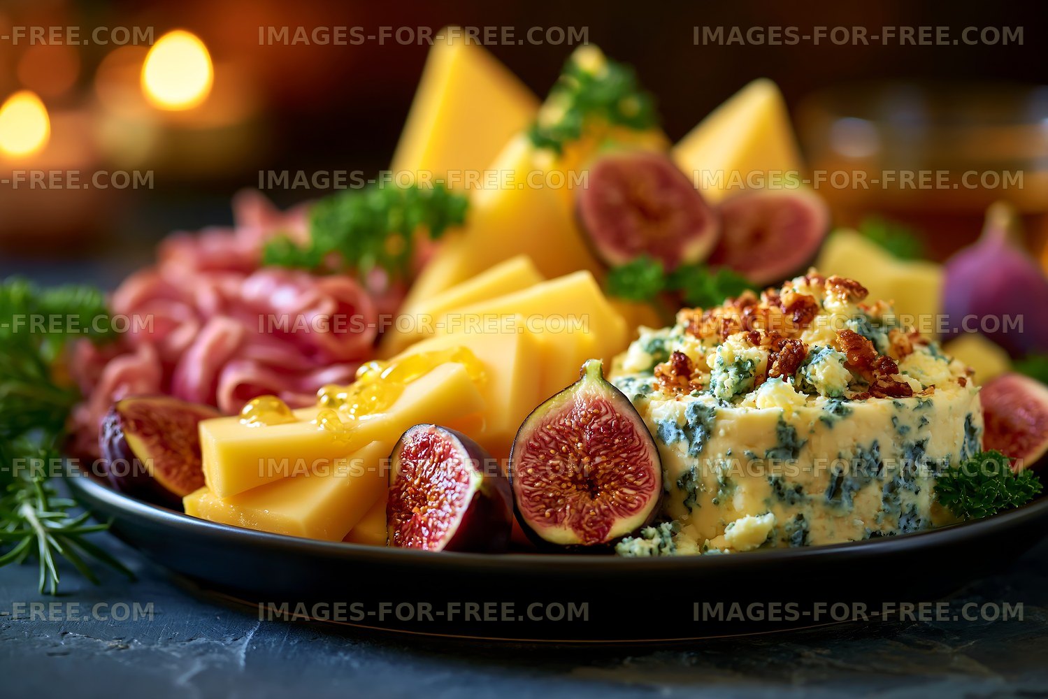 Gourmet cheese platter with figs, meats, and herbs