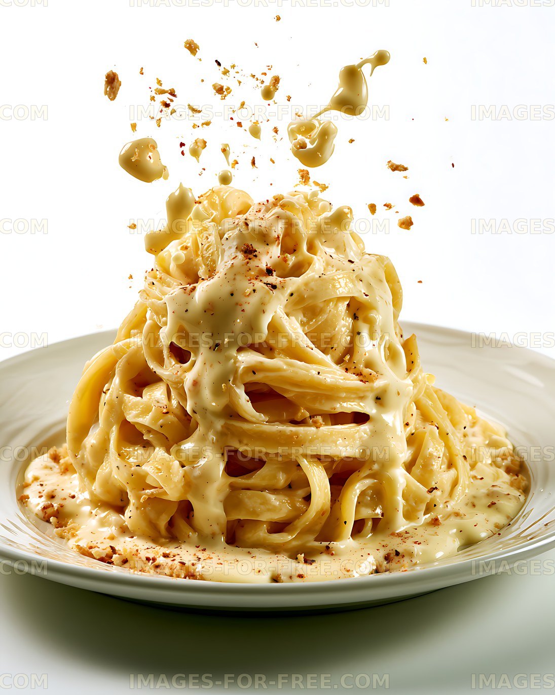 Creamy pasta dish served on a plate with sauce and toppings