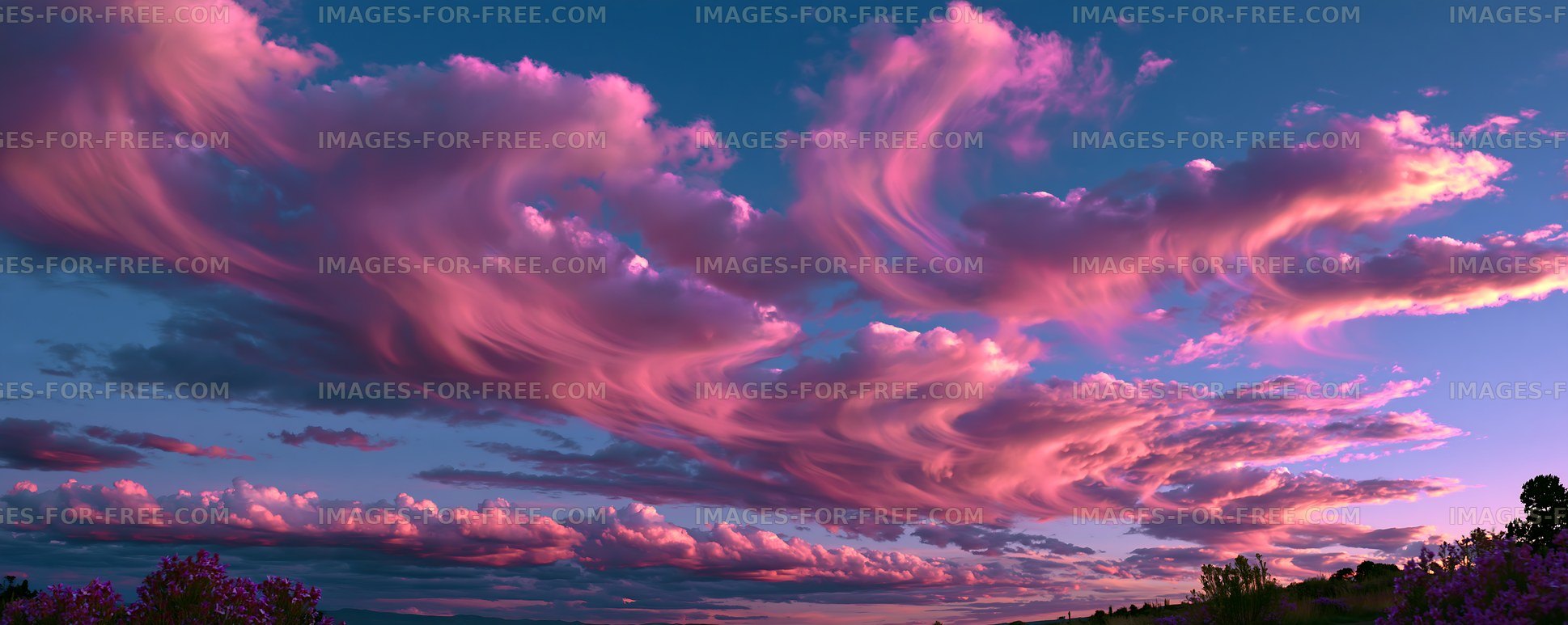 Vibrant sunset clouds over a clear sky with shades of pink and purple