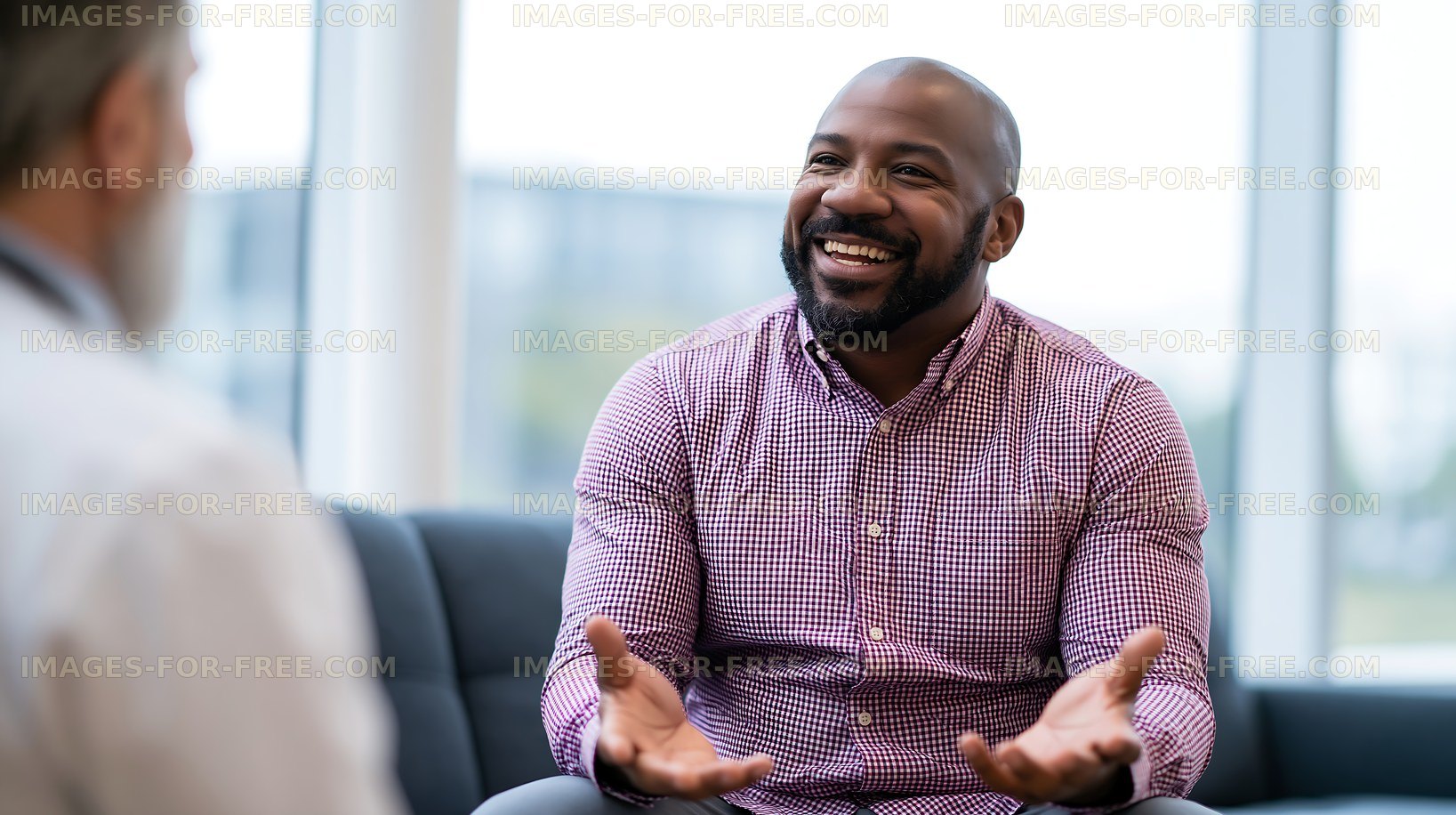 Happy man having a conversation in a modern office