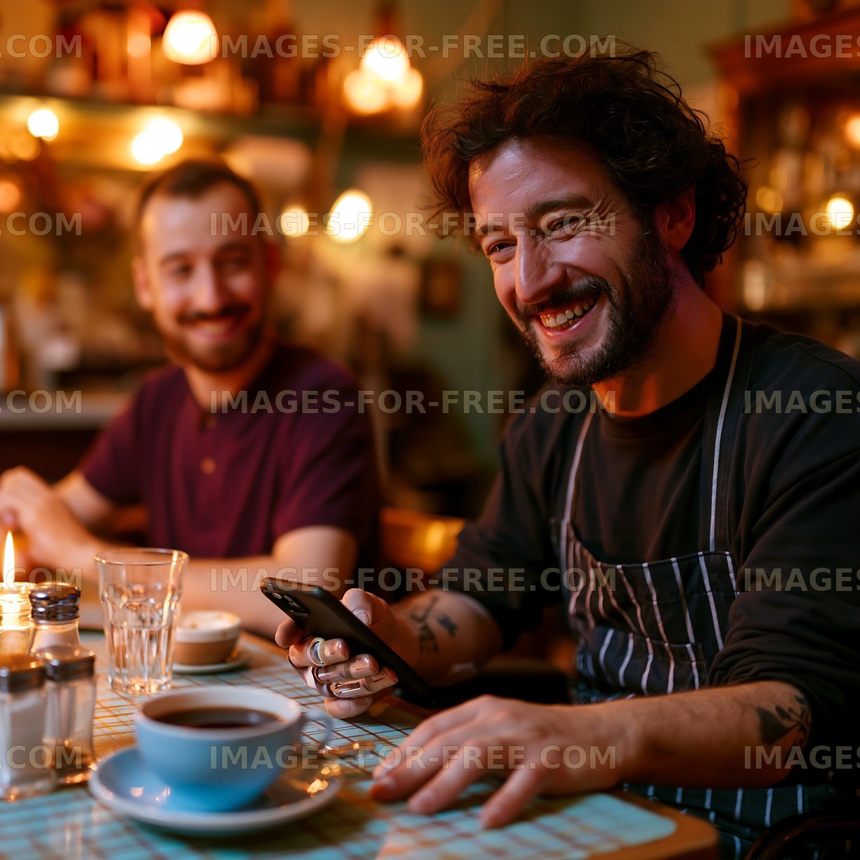 Café worker smiling while using a smartphone