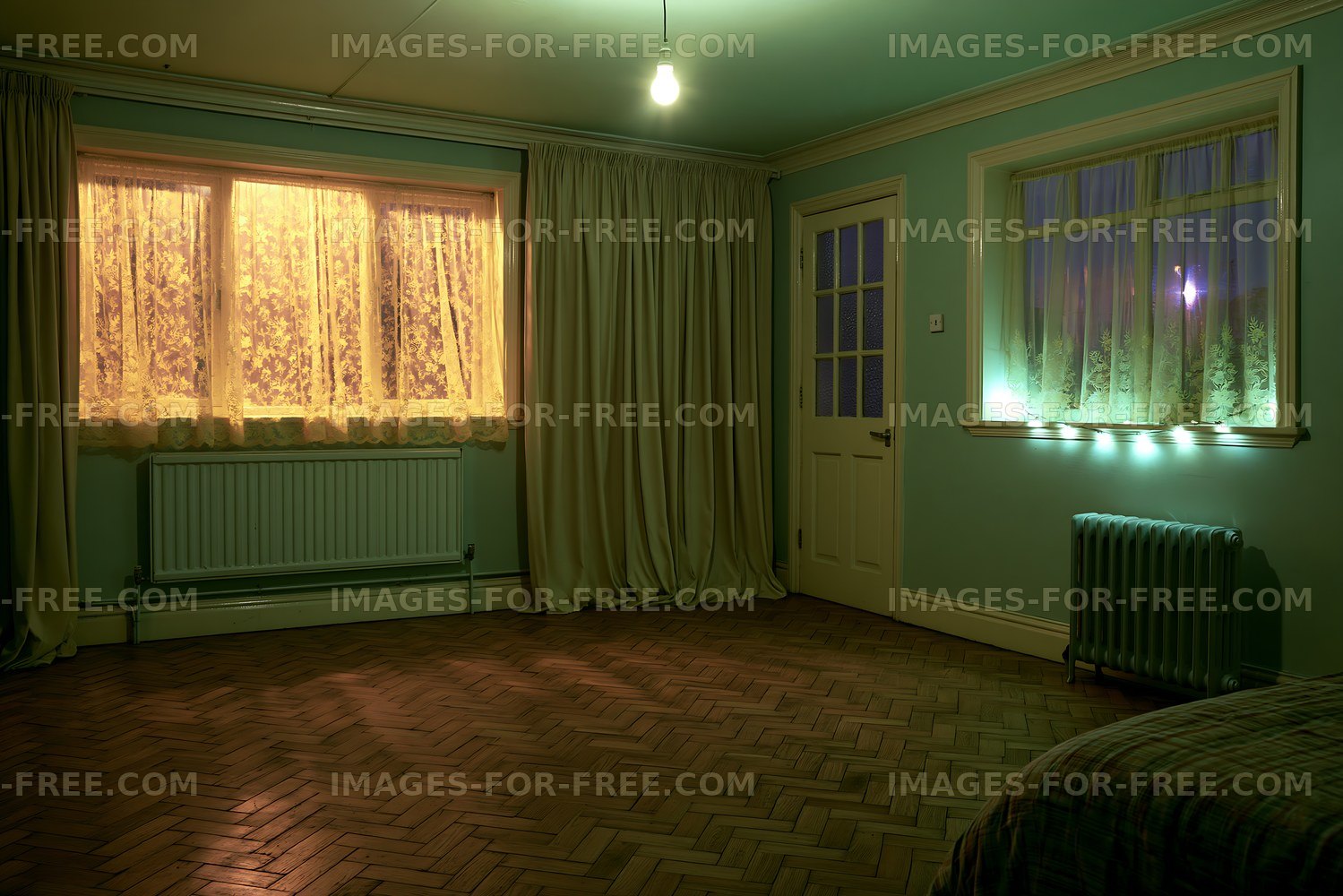 Moody empty interior with green walls and lace curtains