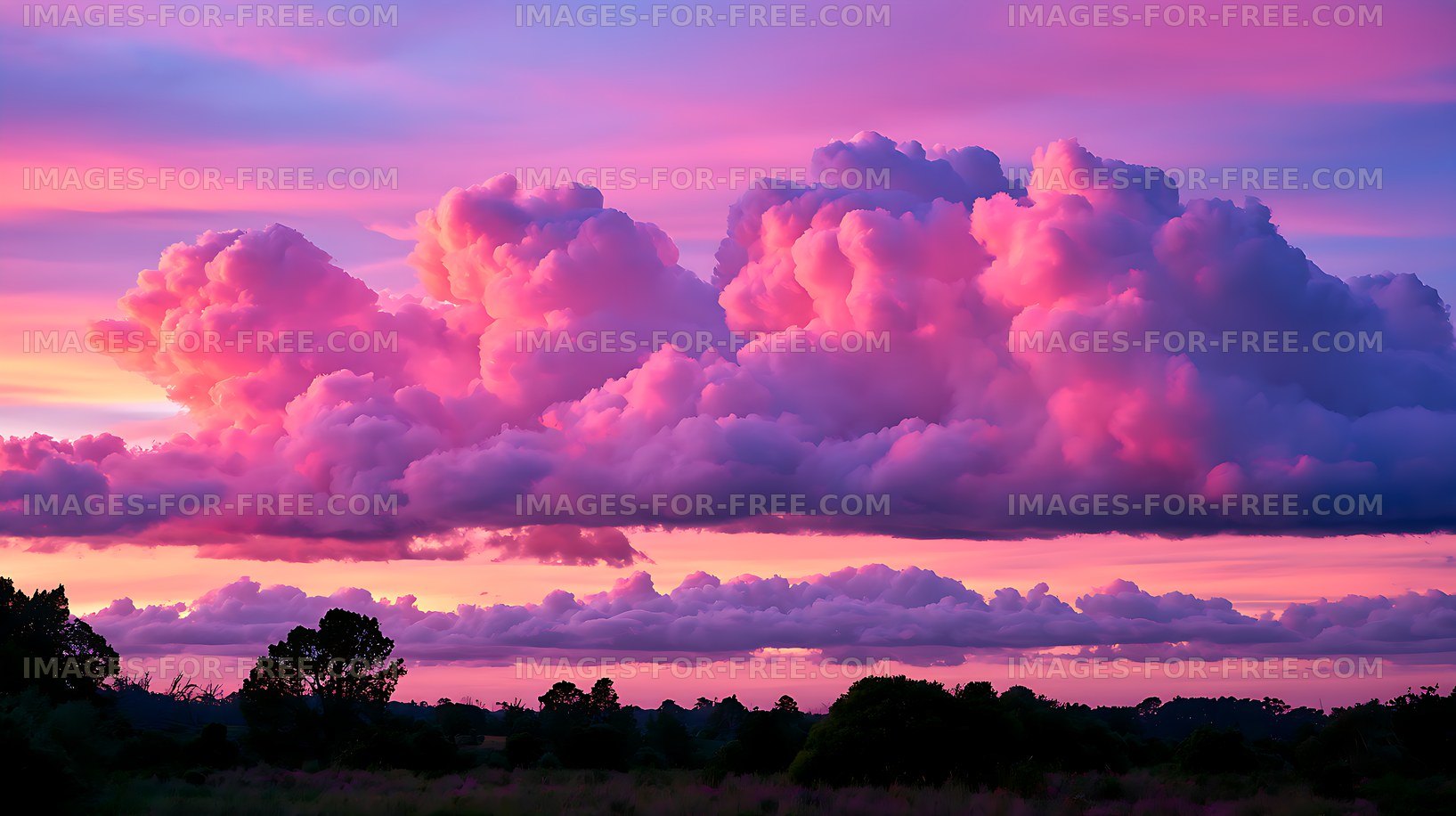 Vivid sunset cloudscape over a dark natural horizon