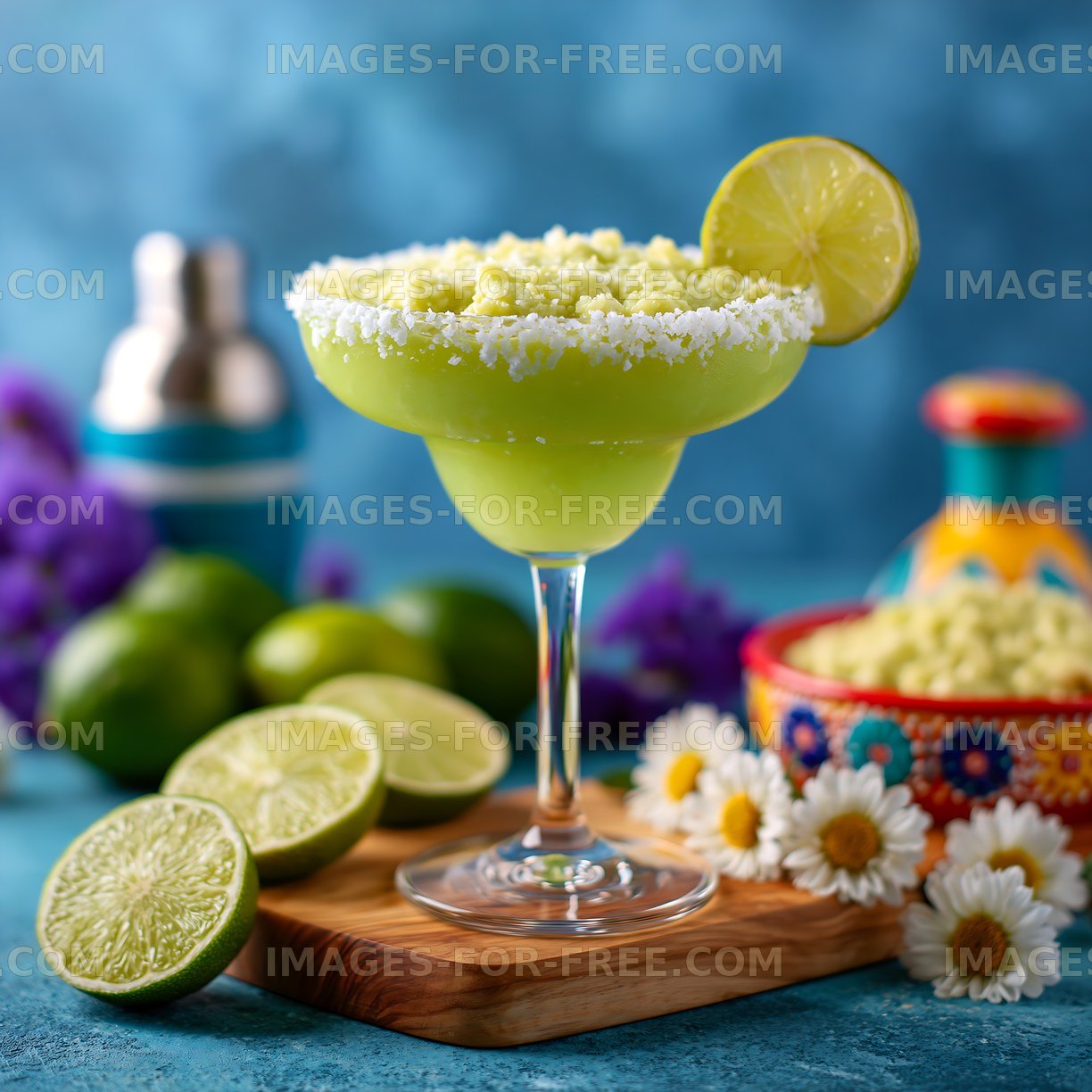 Refreshing lime margarita on a wooden board with cut limes