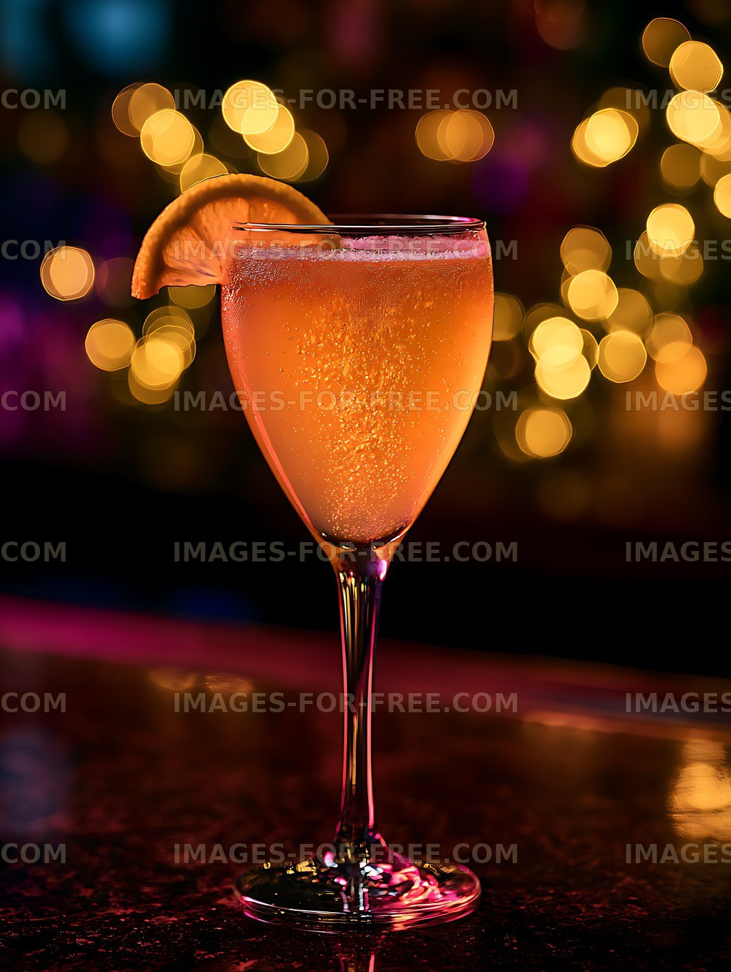 Sparkling orange cocktail with colorful bokeh