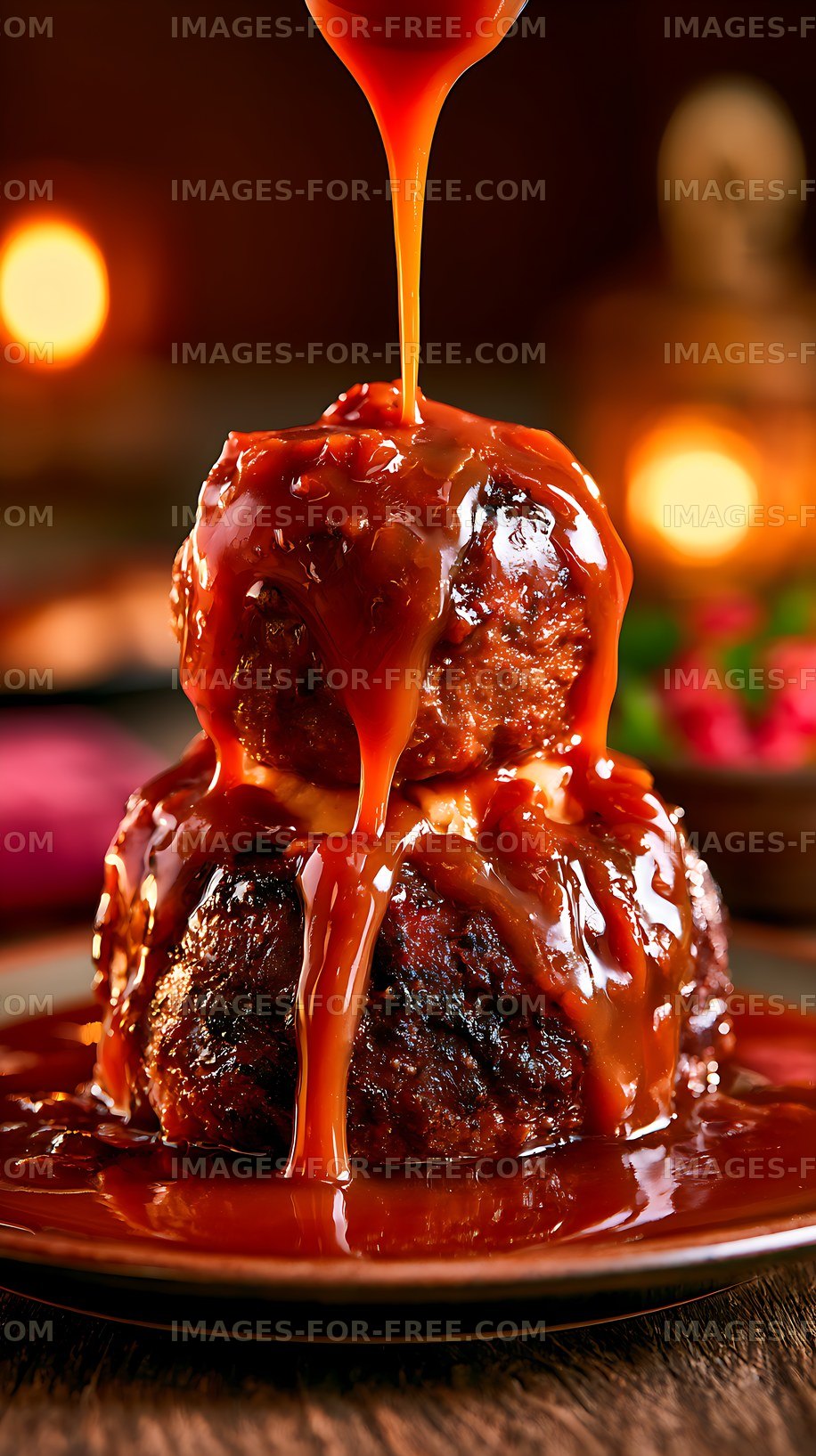 Glossy caramel pouring over a stacked chocolate dessert