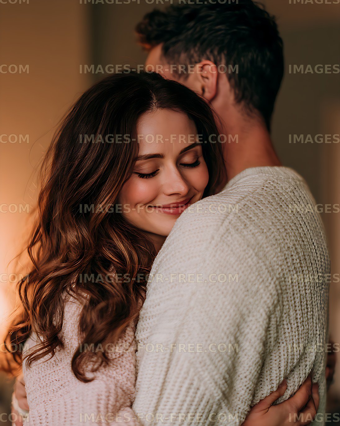 Smiling woman hugging partner in warm indoor light