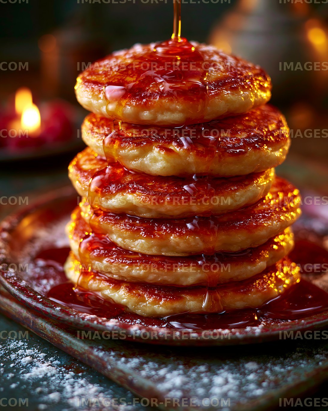 Syrup-covered pancake stack in warm light