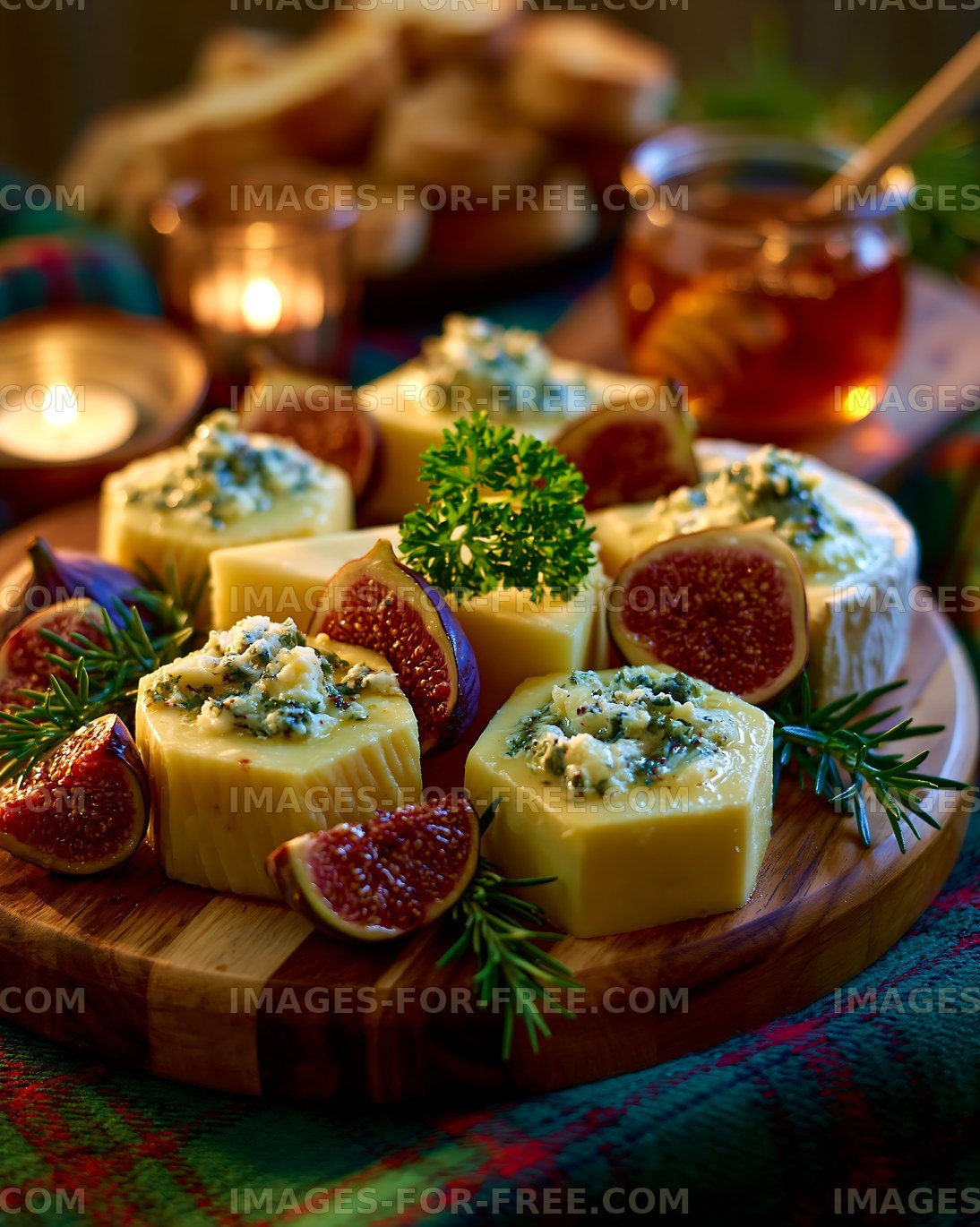 Gourmet cheese platter with figs and warm candlelight