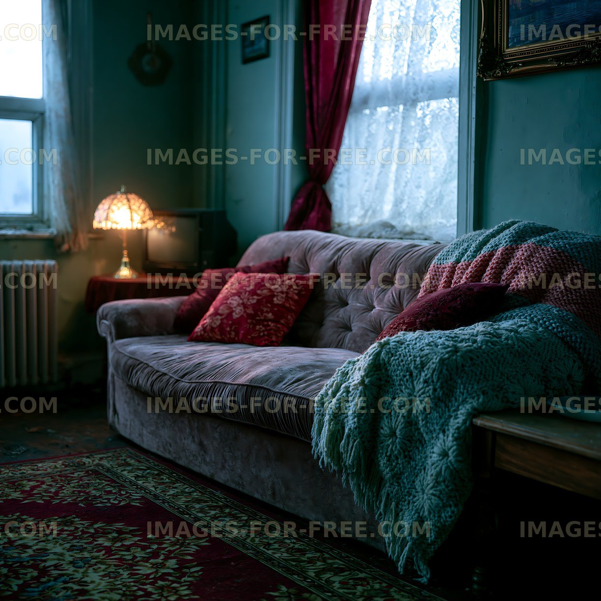 Warmly lit vintage lounge with upholstered sofa and colorful textiles